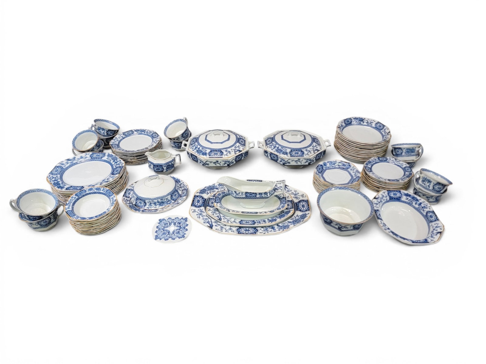 LARGE SET OF "RANGOON WOODS WARE" CHINA: Wood and Sons, England, early 20th century. Large set including various sizes of plates, as well as cups and saucers, bowls, and serving pieces. Provenance: Collection of Bob and Maxine Edwards, New