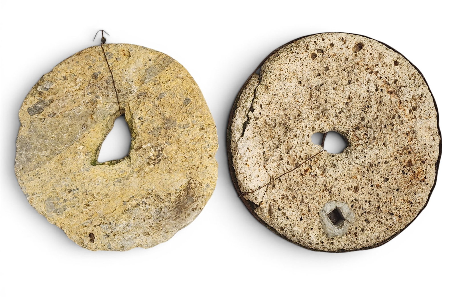 TWO MILLSTONES: European, 19th-20th century. Small size. 16" diameter. Provenance: a Kentucky collection. NOTE: We are happy to answer questions and take additional photos of lots prior to the auction (the sooner