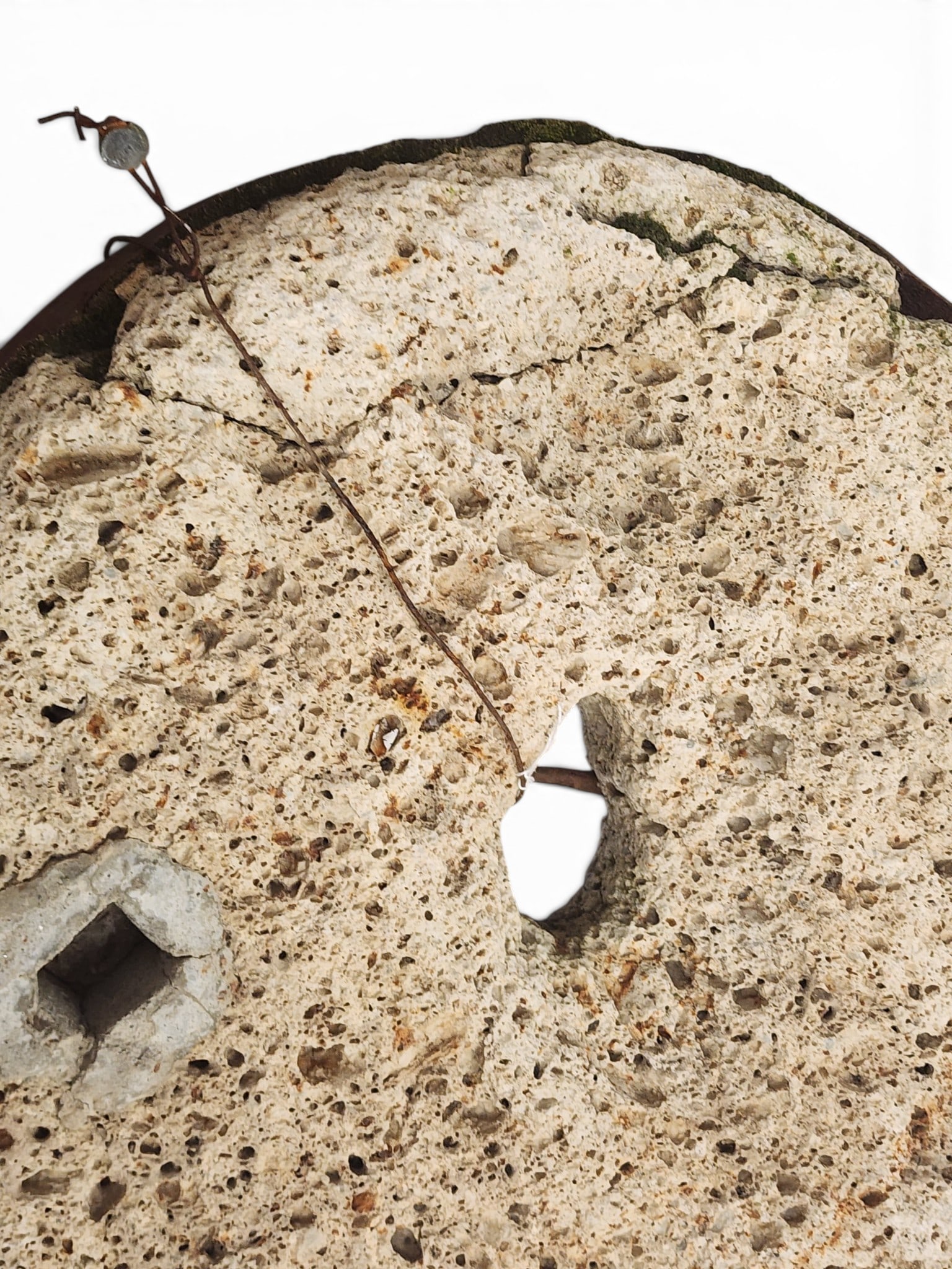 TWO MILLSTONES: European, 19th-20th century. Small size. 16" diameter. Provenance: a Kentucky collection. NOTE: We are happy to answer questions and take additional photos of lots prior to the auction (the sooner