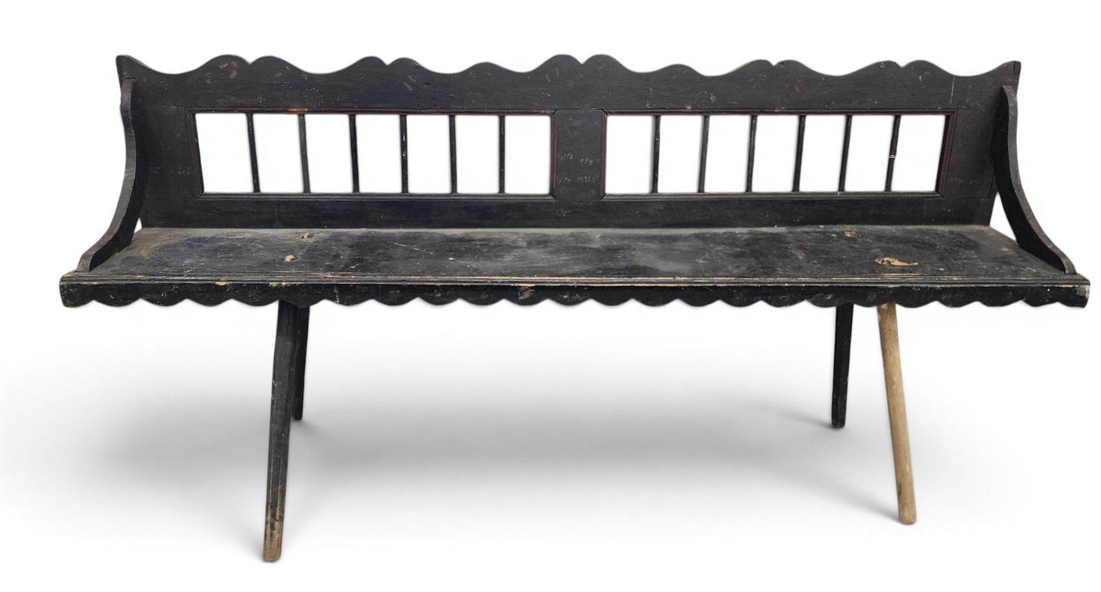 DECORATED SETTEE: European, 19th century, mixed woods. Spindle back and shaped crest and skirt, and with old/original floral decoration on a black ground. 33.5" high, 72.25" long. Provenance: a Kentucky collection. NOT