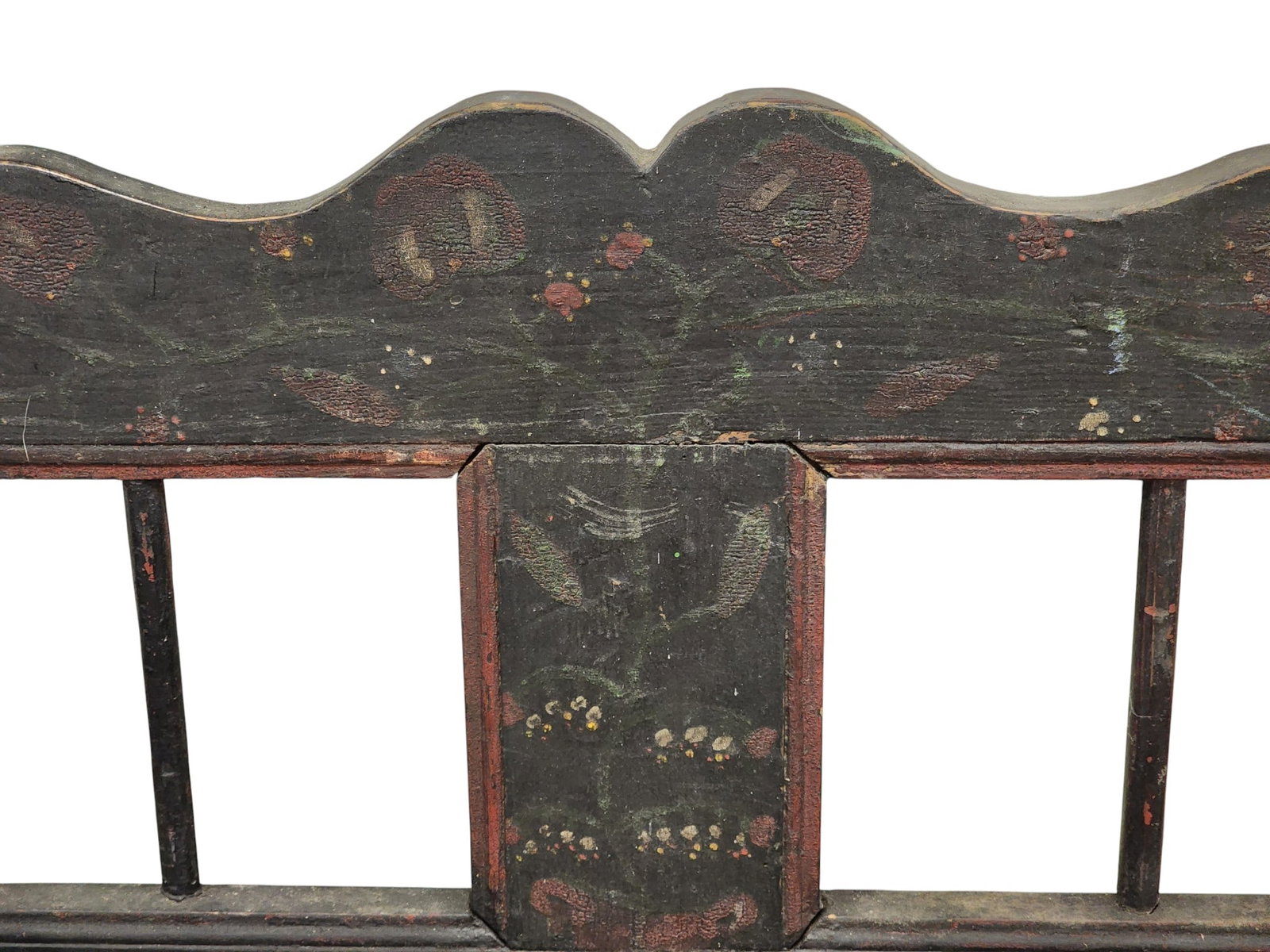 DECORATED SETTEE: European, 19th century, mixed woods. Spindle back and shaped crest and skirt, and with old/original floral decoration on a black ground. 33.5" high, 72.25" long. Provenance: a Kentucky collection.