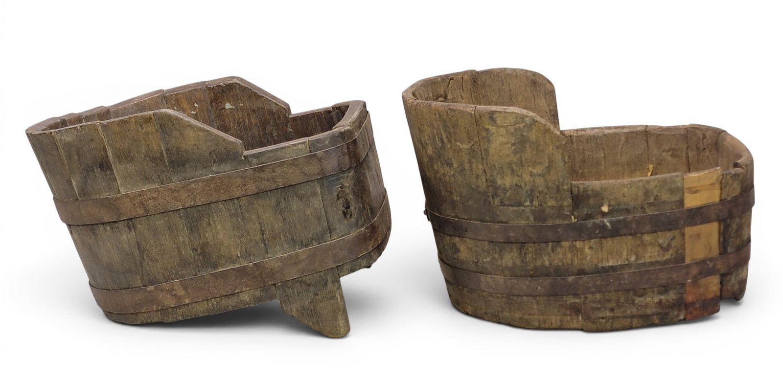 TWO WINE FUNNELS: European, early 20th century. Stave constructed, with iron bands. 15" and 19" long. Provenance: a Kentucky collection. NOTE: We are happy to answer questions and take additional photos of lots prior