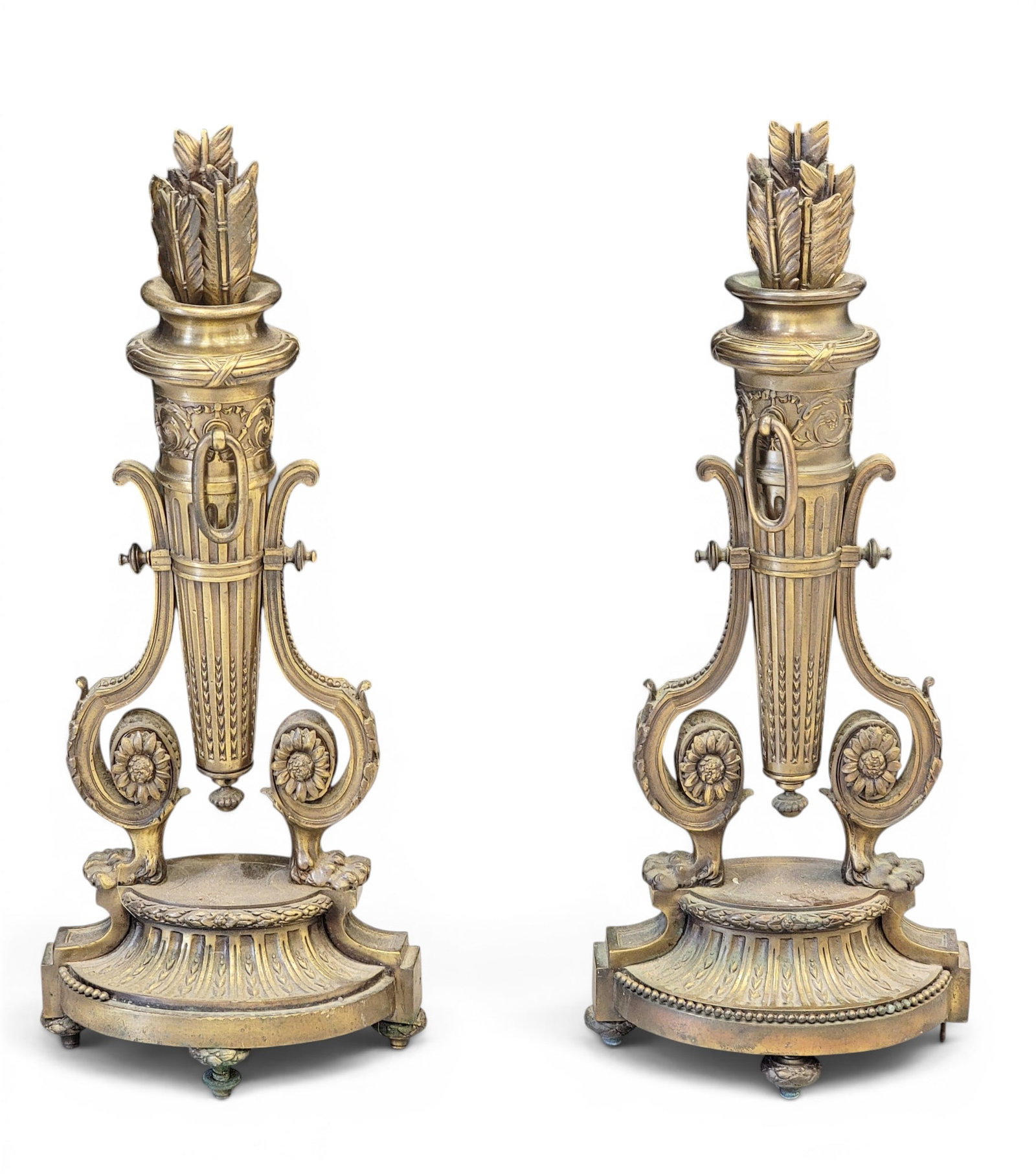 PAIR OF FRENCH ANDIRONS: 19th century, brass. Arrows and quivers, on scrollwork bases. 22" high. Provenance: a northeast Ohio collection. NOTE: We are happy to answer questions and take additional photos of lots prior to the