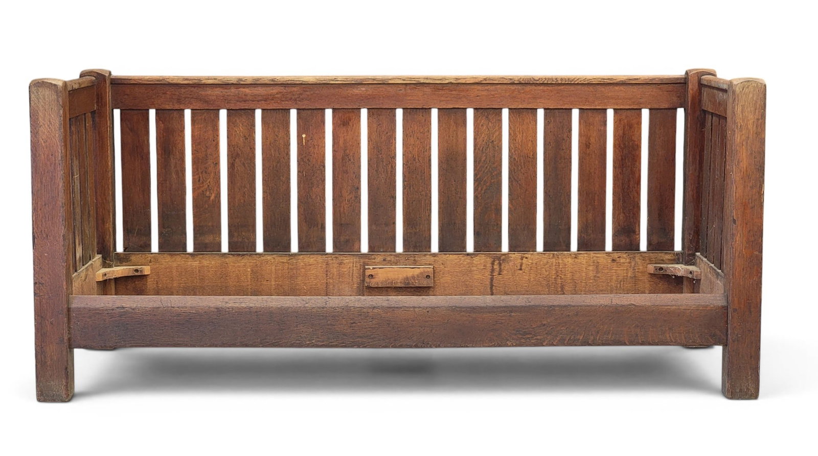 STICKLEY ARTS & CRAFTS SETTEE: Marked for L. & J. G. Stickley, Fayetteville, New York, early 20th century, oak. Level arms and back, and with a chamfered front seat rail. 33.75" high, 76" long. Provenance: a Pennsylvania