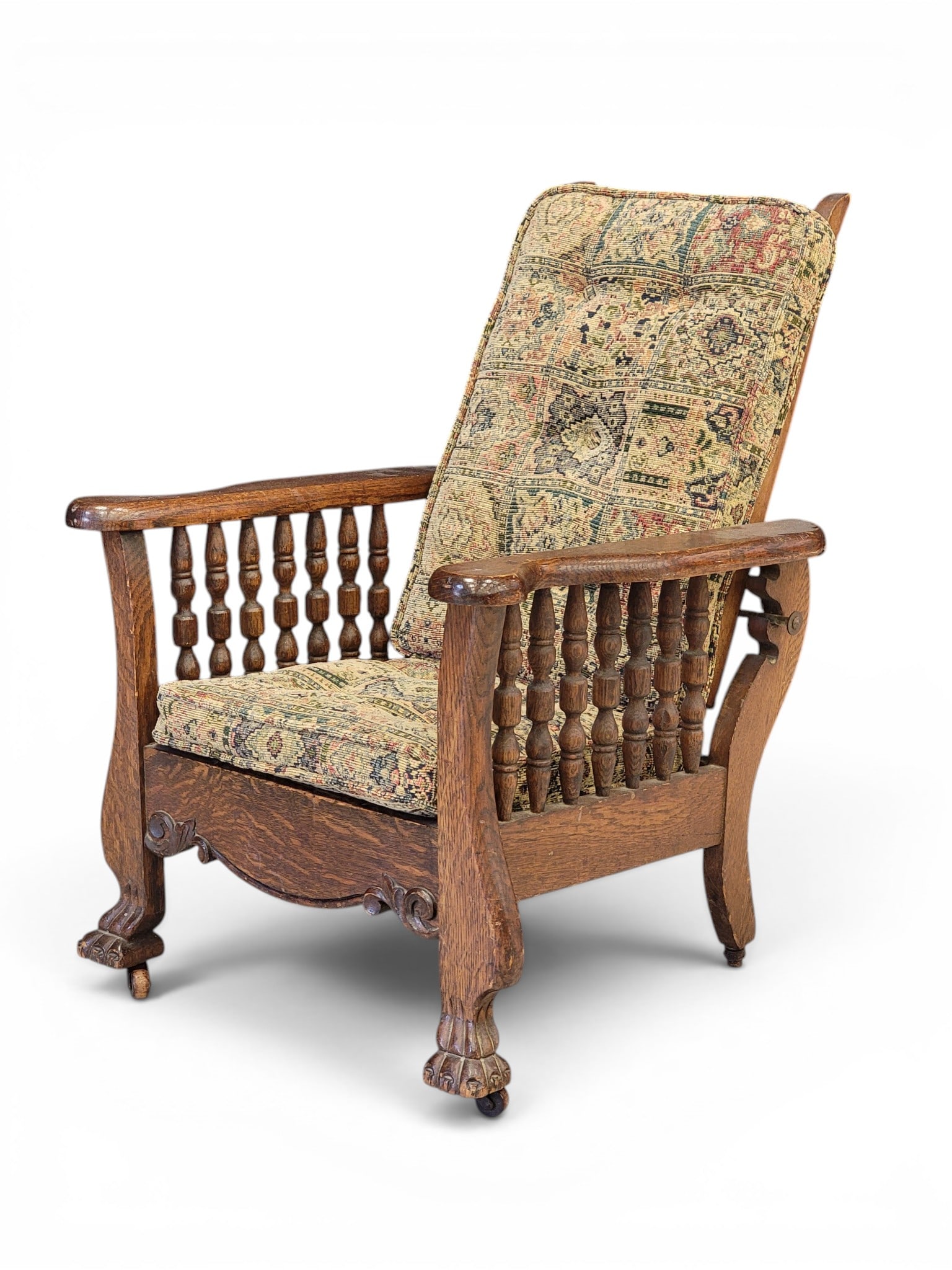 CHILD'S MORRIS CHAIR: Late 19th-early 20th century, oak. Reclining chair with spring seat, and paw feet. 27.5" high. Provenance: a northeast Ohio collection. NOTE: We are happy to answer questions and take additional