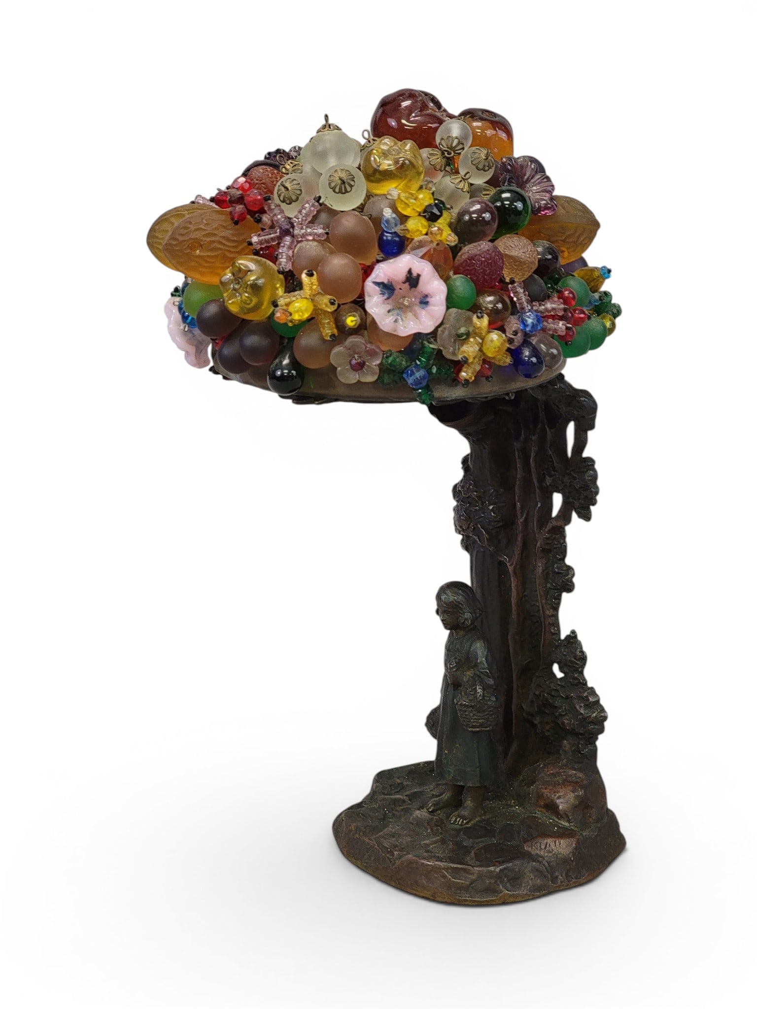 SIGNED CZECH GLASS FRUIT LAMP: Early 20th century. Illegibly signed bronze base depicting a girl holding a basket of fruit under a tree, and the canopy of the tree comprises a collection of glass fruit. 11" high. Provenance: a