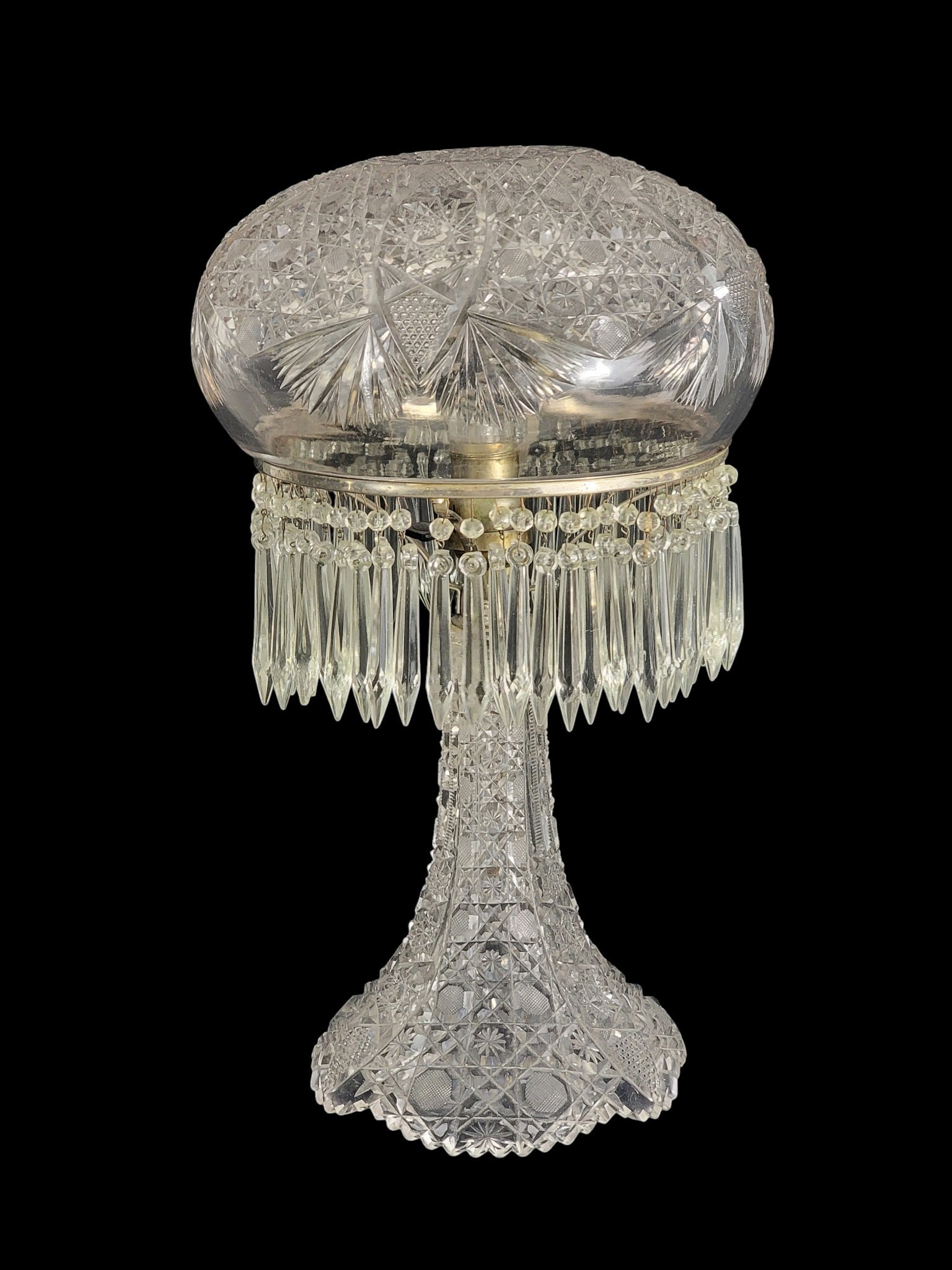 AMERICAN BRILLIANT CUT GLASS TABLE LAMP: Early 20th century. Cut glass base and shade, and with period/original prisms. 17.5" high; shade is 10" diameter. Provenance: a northeast Ohio collection. NOTE: We are happy to answer questions and