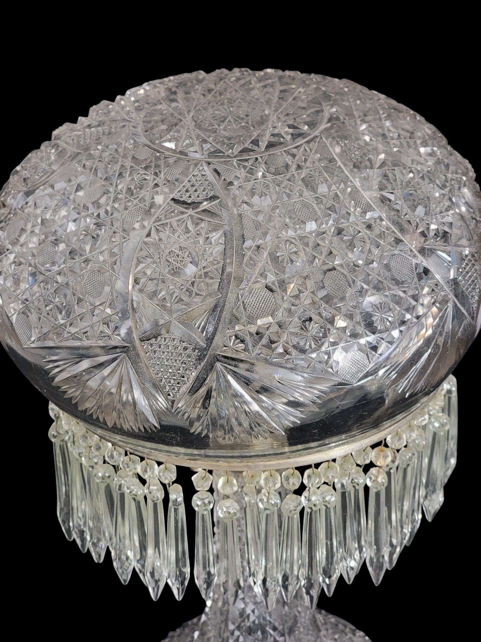 AMERICAN BRILLIANT CUT GLASS TABLE LAMP: Early 20th century. Cut glass base and shade, and with period/original prisms. 17.5" high; shade is 10" diameter. Provenance: a northeast Ohio collection. NOTE: We are happy to answer questions and ta
