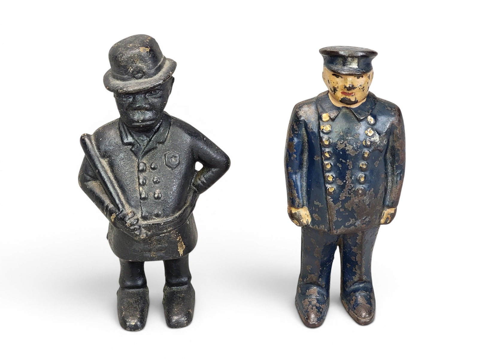 TWO CAST IRON POLICEMAN BANKS: Includes AC Williams or Hubley Mulligan (Moore 177); together with Arcade Policeman (Moore 182). Provenance: a northeast Ohio collection. NOTE: We are happy to answer questions and take additional pho