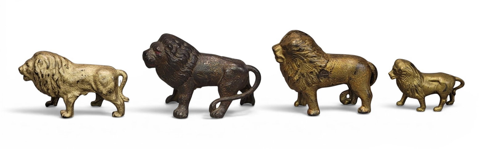 FOUR CAST IRON LION BANKS (1 of 4)