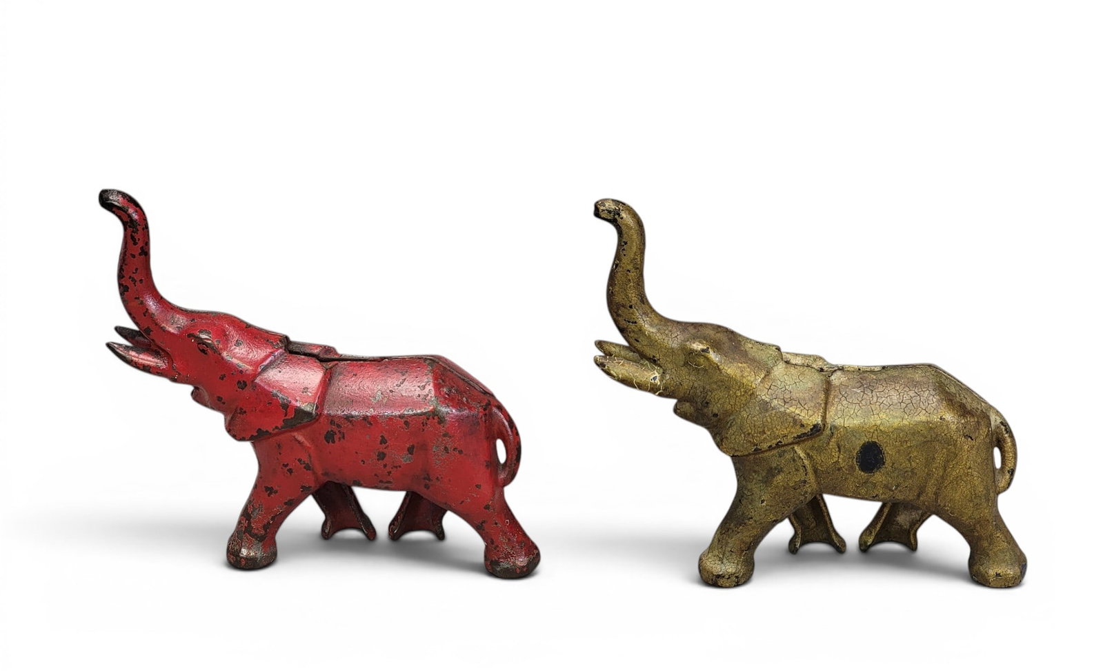TWO CAST IRON ELEPHANT BANKS: Art Deco Elephants (Moore 449). Provenance: a northeast Ohio collection. NOTE: We are happy to answer questions and take additional photos of lots prior to the auction (the sooner submitted the better