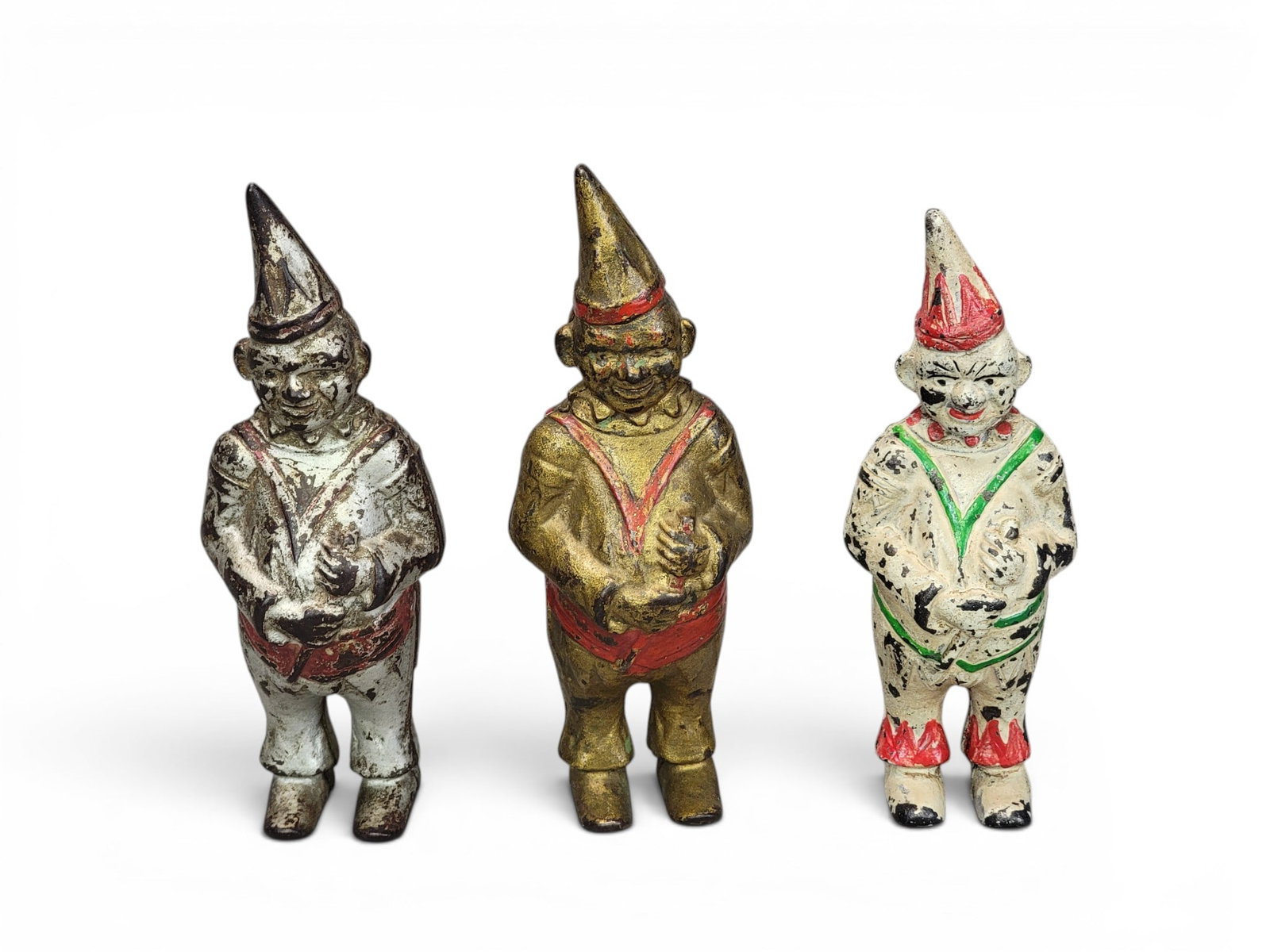 THREE CAST IRON CLOWN BANKS: AC Williams (Moore 211). Provenance: a northeast Ohio collection. NOTE: We are happy to answer questions and take additional photos of lots prior to the auction (the sooner submitted the better). Any 