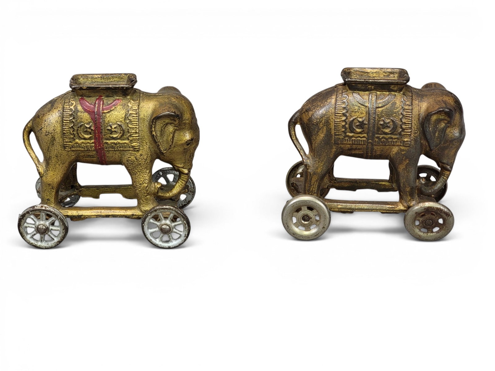 TWO ELEPHANT CAST IRON BANKS: AC Williams, Elephants on Wheels (Moore 446). Provenance: a northeast Ohio collection. NOTE: We are happy to answer questions and take additional photos of lots prior to the auction (the sooner submit