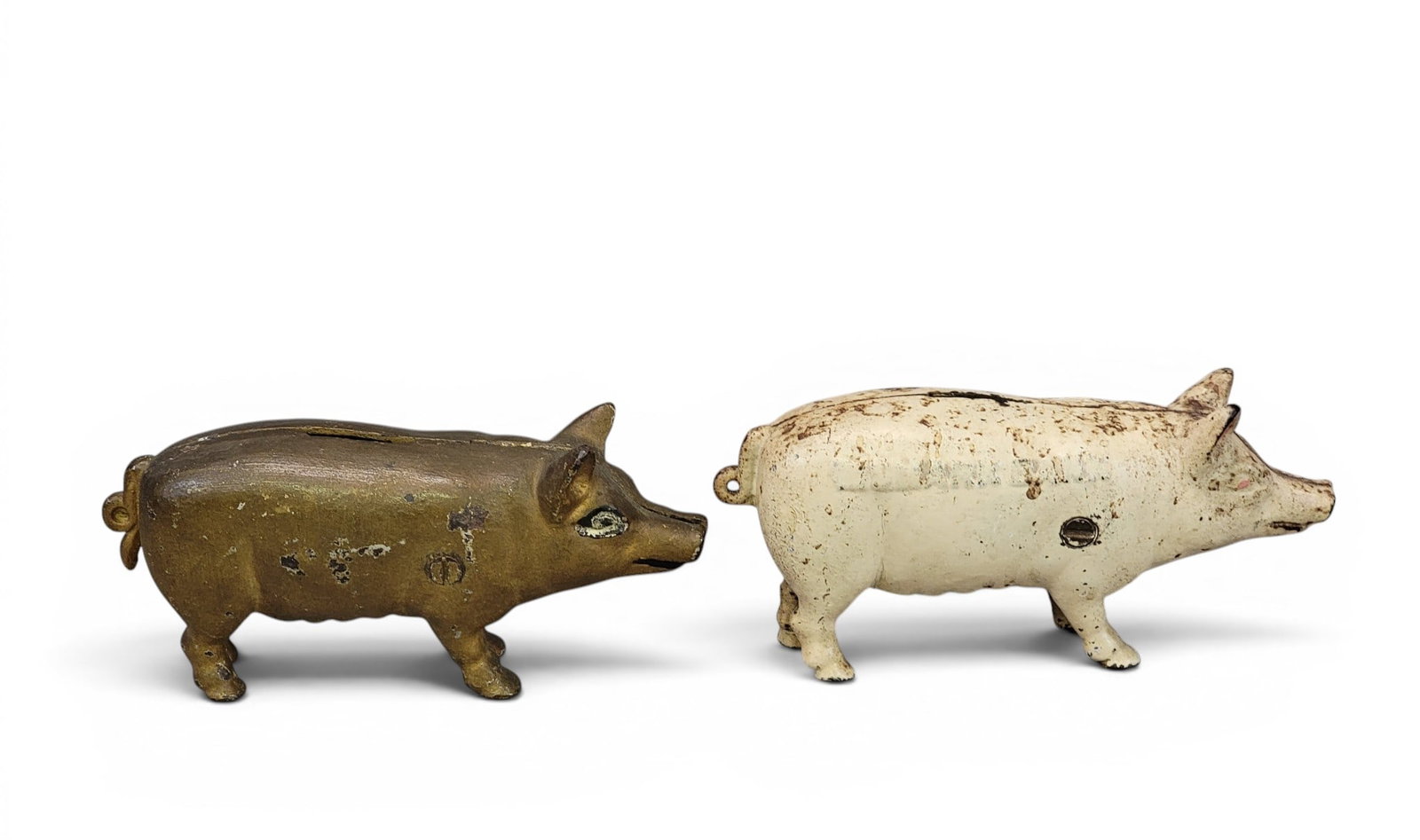 TWO CAST IRON PIG BANKS (1 of 4)