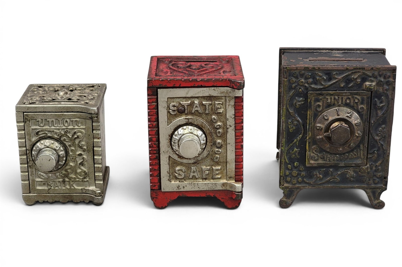 THREE CAST IRON SAFE BANKS: Includes Junior Safe Deposit (Moore 898); State Safe in red, 4.125" high; and Kenton Union Bank (Moore Kenton catalog no. 568). Provenance: a northeast Ohio collection. NOTE: We are happy to answer qu