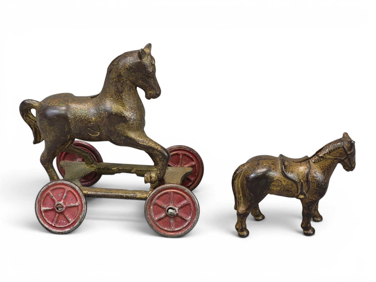 TWO CAST IRON HORSE BANKS: Includes AC Williams Horse on Wheels (Moore 512); together with AC Williams Saddle Horse Small (Moore 523). Provenance: a northeast Ohio collection. NOTE: We are happy to answer questions and take add