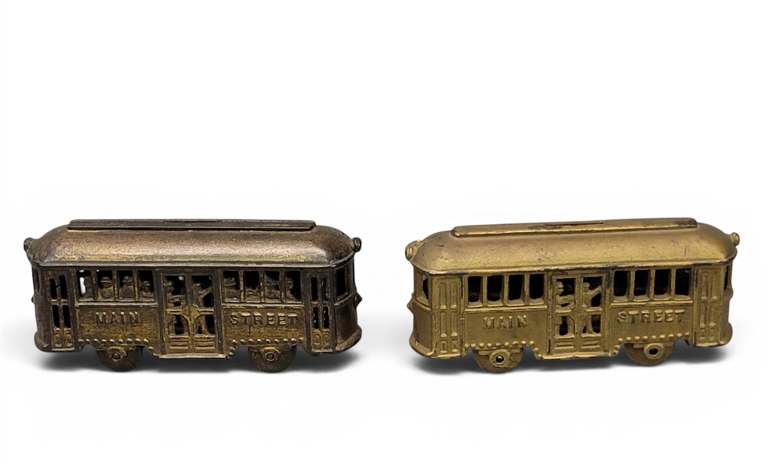 TWO MAIN STREET TROLLEY CAST IRON BANKS: AC Williams. With and without people (Moore 1467 and 1471). Provenance: a northeast Ohio collection. NOTE: We are happy to answer questions and take additional photos of lots prior to the auction