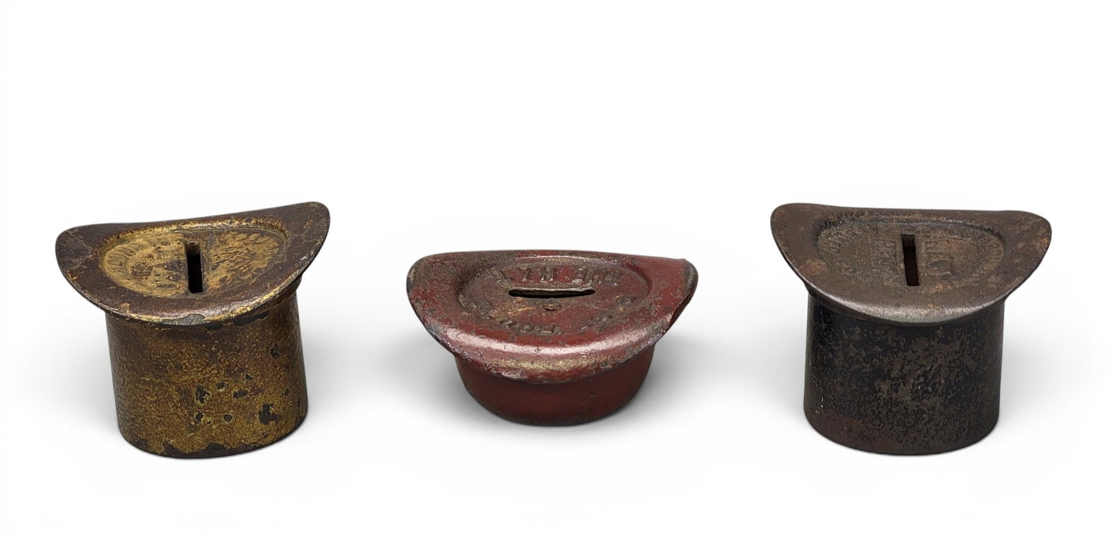 THREE CAST IRON HAT BANKS: Includes two Lincoln High Hat "Pass Around the Hat) (Moore 1380); together with a Derby "Pass 'Round the Hat" (Moore 1381). Provenance: a northeast Ohio collection. NOTE: We are happy to answer