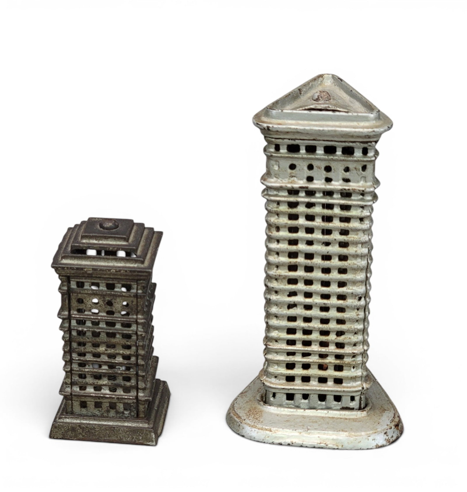 TWO CAST IRON BUILDING BANKS: Includes Kenton Flat Iron Building no trap (Moore 1161); together with Kenton High Rise Tiered (Moore 1218). Provenance: a northeast Ohio collection. NOTE: We are happy to answer questions and take