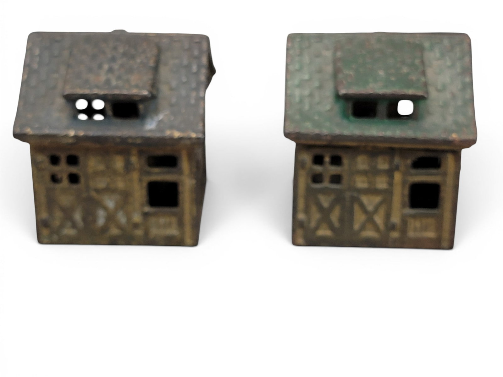 TWO CAST IRON GARAGE BANKS: AC Williams, One Car Garage (Moore 1009). Provenance: a northeast Ohio collection. NOTE: We are happy to answer questions and take additional photos of lots prior to the auction (the sooner submitted