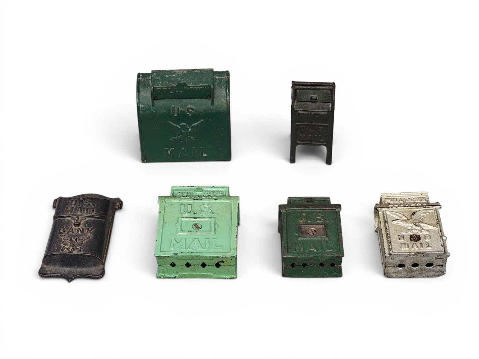 SIX CAST IRON MAILBOX BANKS: Includes AC Williams Hanging US Mail (Moore 856); Hubley US Mail with Eagle (Moore 855); Hubley Small Standing Mailbox (Moore 842); AC Williams US Mail slot in rear (Moore 854); AC Williams US Mail (M