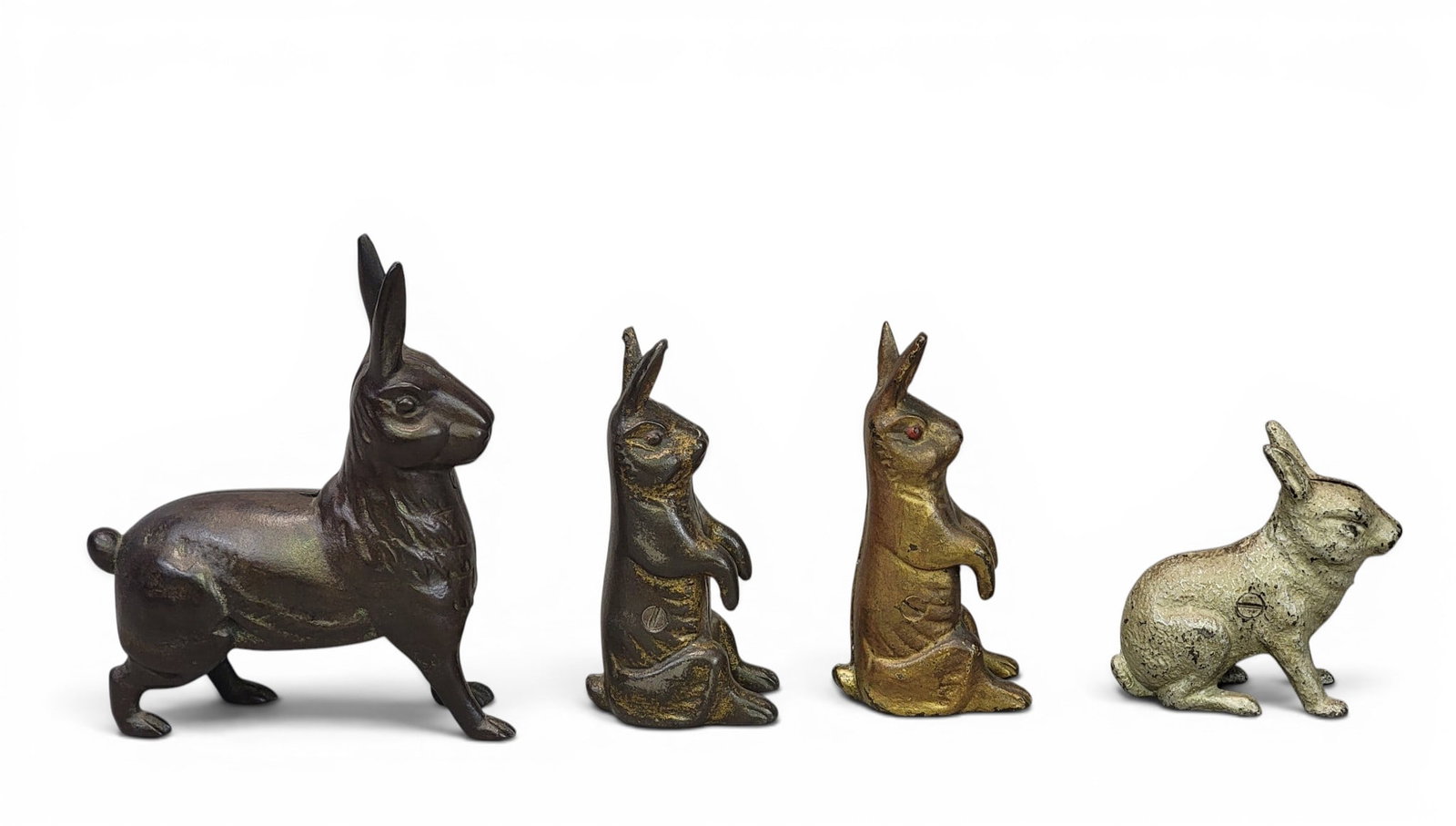 FOUR CAST IRON RABBIT BANKS (1 of 4)