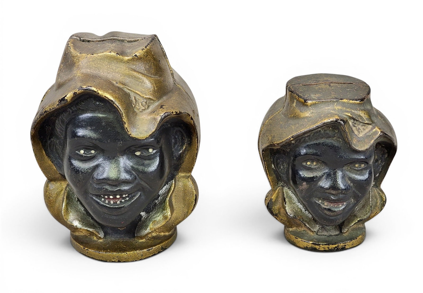 TWO CAST IRON TWO-FACED BANKS: AC Williams, Two-Faced Black Boy / Negro Toy Bank (Moore 83 and 84). Provenance: a northeast Ohio collection. NOTE: We are happy to answer questions and take additional photos of lots prior to the auc