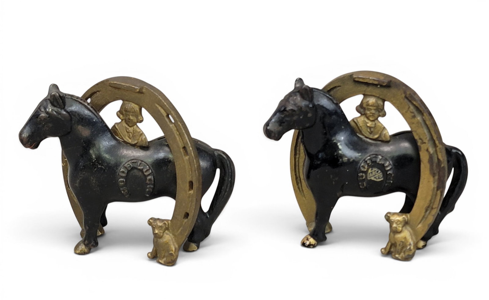 TWO CAST IRON HORSE SHOE BANKS: Arcade, Good Luck Horseshoe / Buster Brown and Tige (Moore 508). Provenance: a northeast Ohio collection. NOTE: We are happy to answer questions and take additional photos of lots prior to the auction