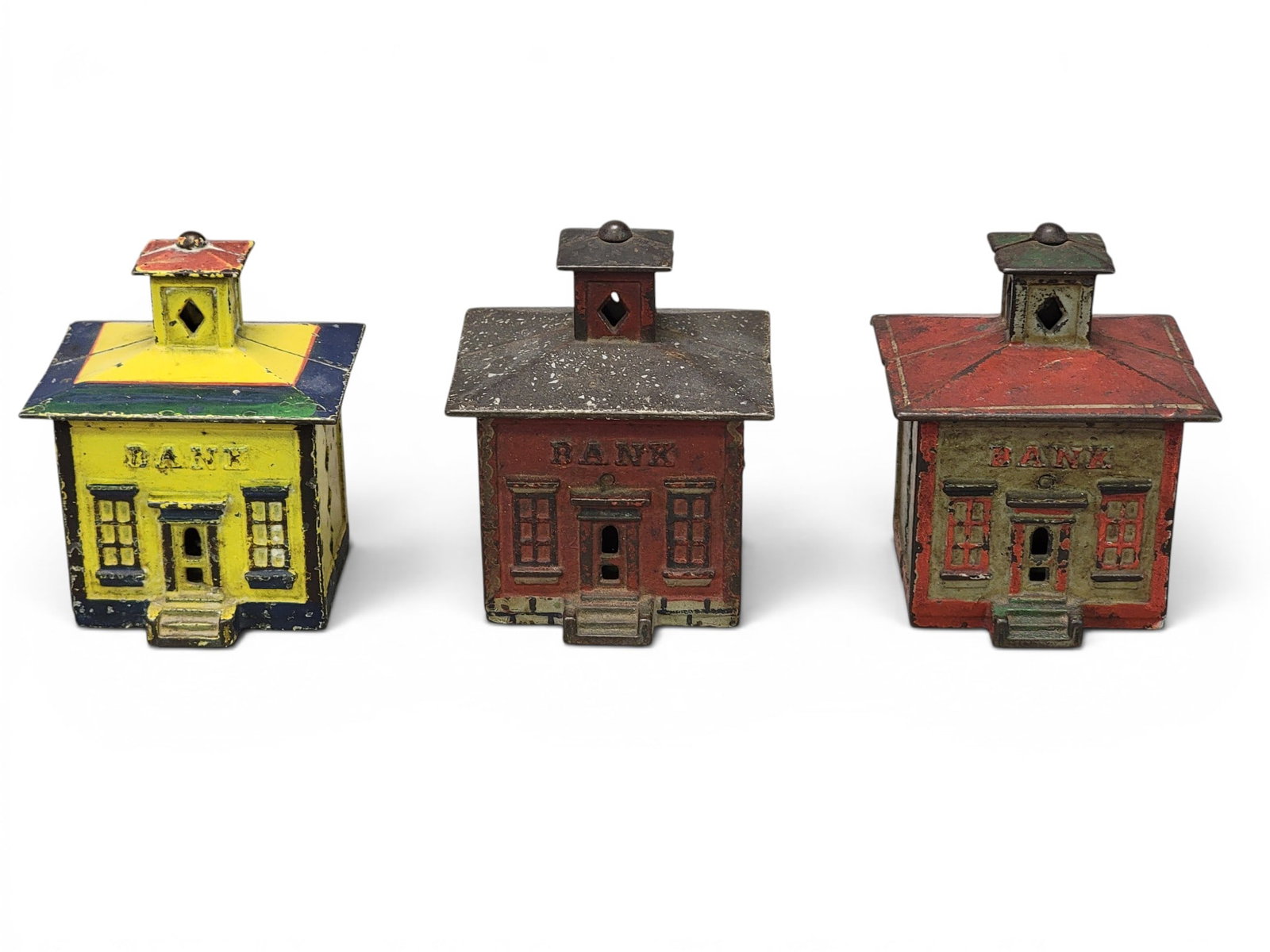 THREE CAST IRON BUILDING BANKS: J&E Stevens Cupola Banks, one with mica (Moore 1146). Provenance: a northeast Ohio collection. NOTE: We are happy to answer questions and take additional photos of lots prior to the auction (the soone
