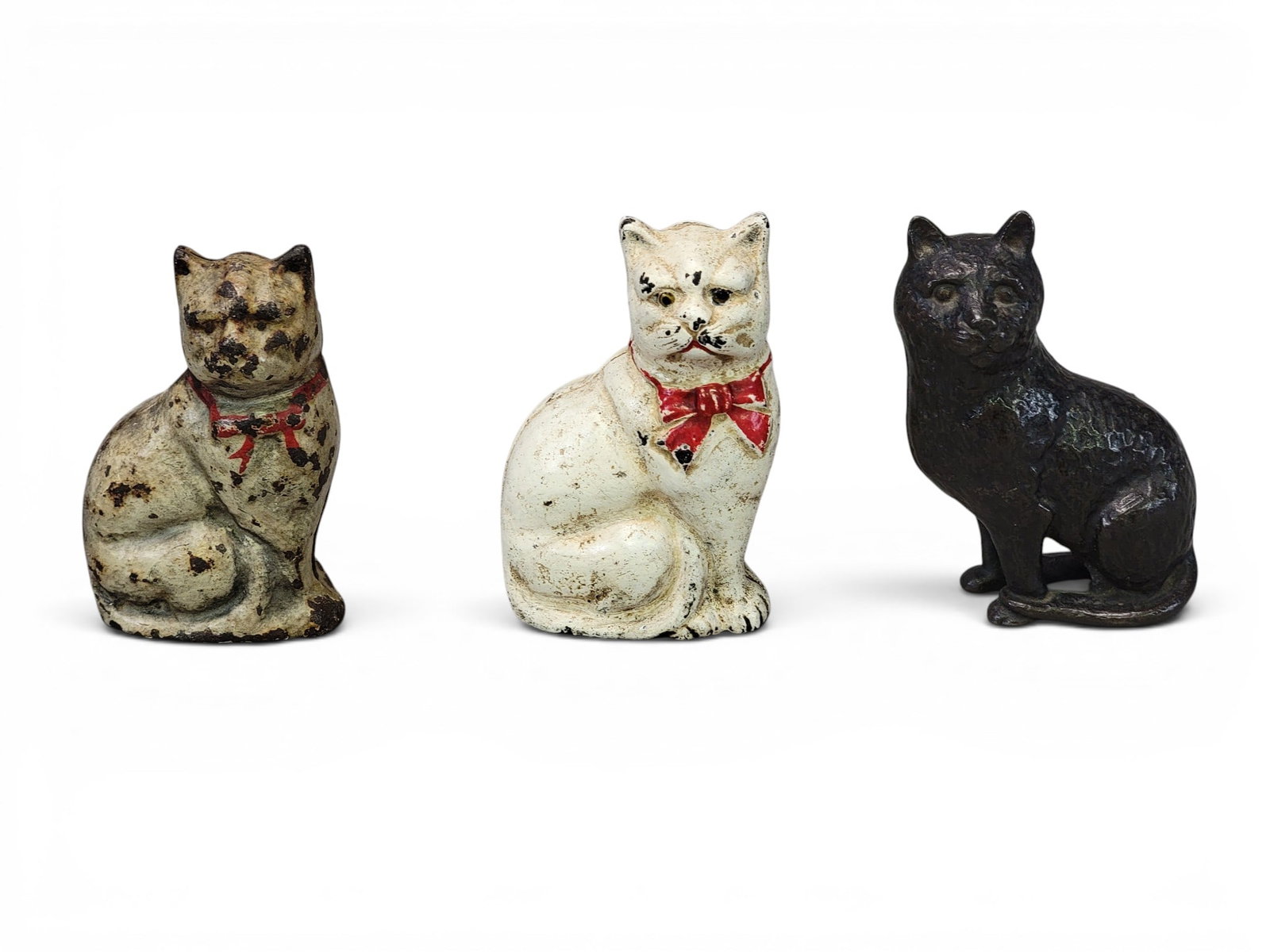 THREE CAST IRON CAT BANKS (1 of 3)