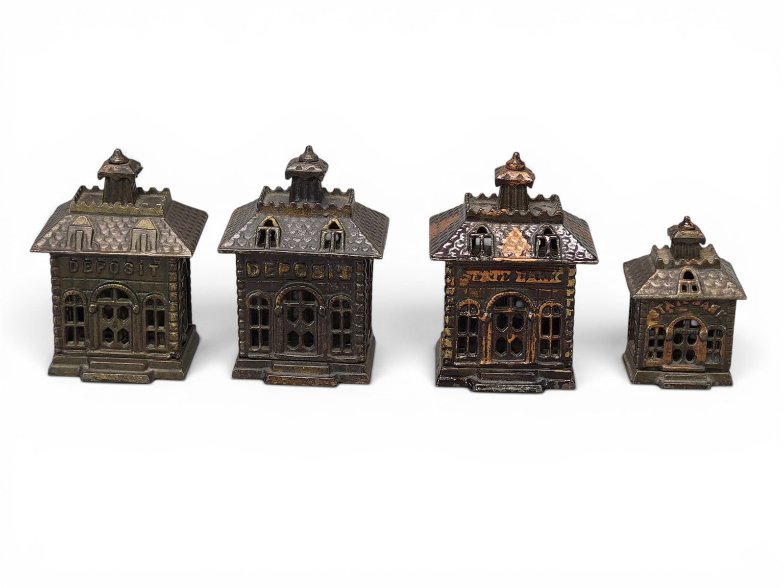 FOUR CAST IRON BANK BANKS (1 of 7)