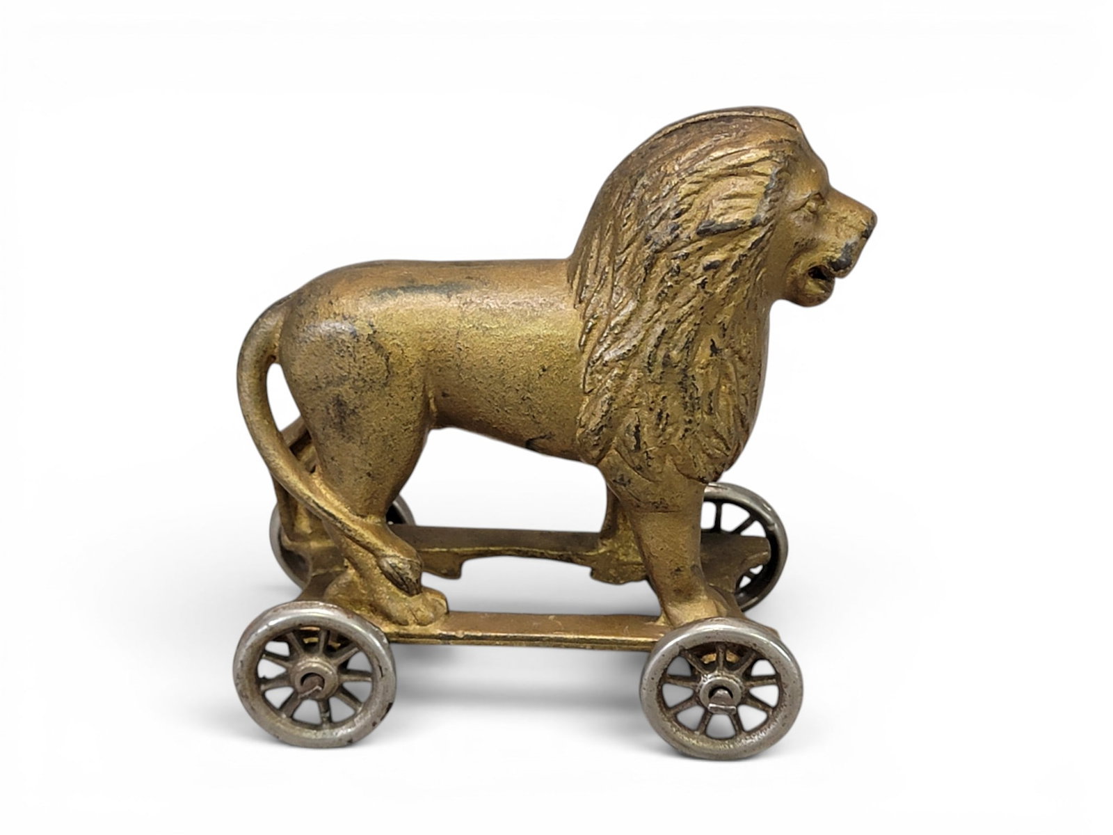 CAST IRON LION ON WHEELS BANK: AC Williams (Moore 760). Provenance: a northeast Ohio collection. NOTE: We are happy to answer questions and take additional photos of lots prior to the auction (the sooner submitted the better). Any 