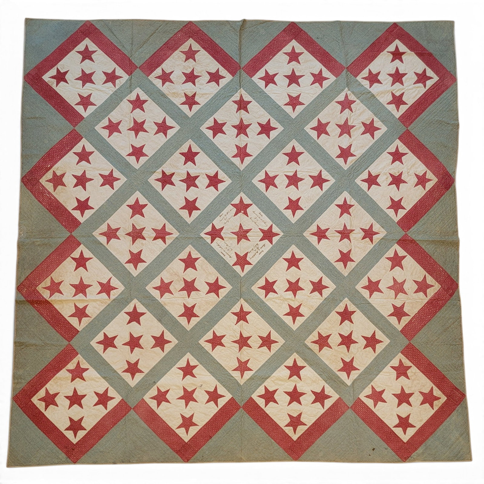 RED, WHITE, AND BLUE "UNION" PRESENTATION QUILT: Appliqued red stars and quilted hearts in a red and blue grid. At center, four times is an inked presentation: "Union / Presented to C.K. Fleming / by the Youth of Pemberton". 90" by 92.5".