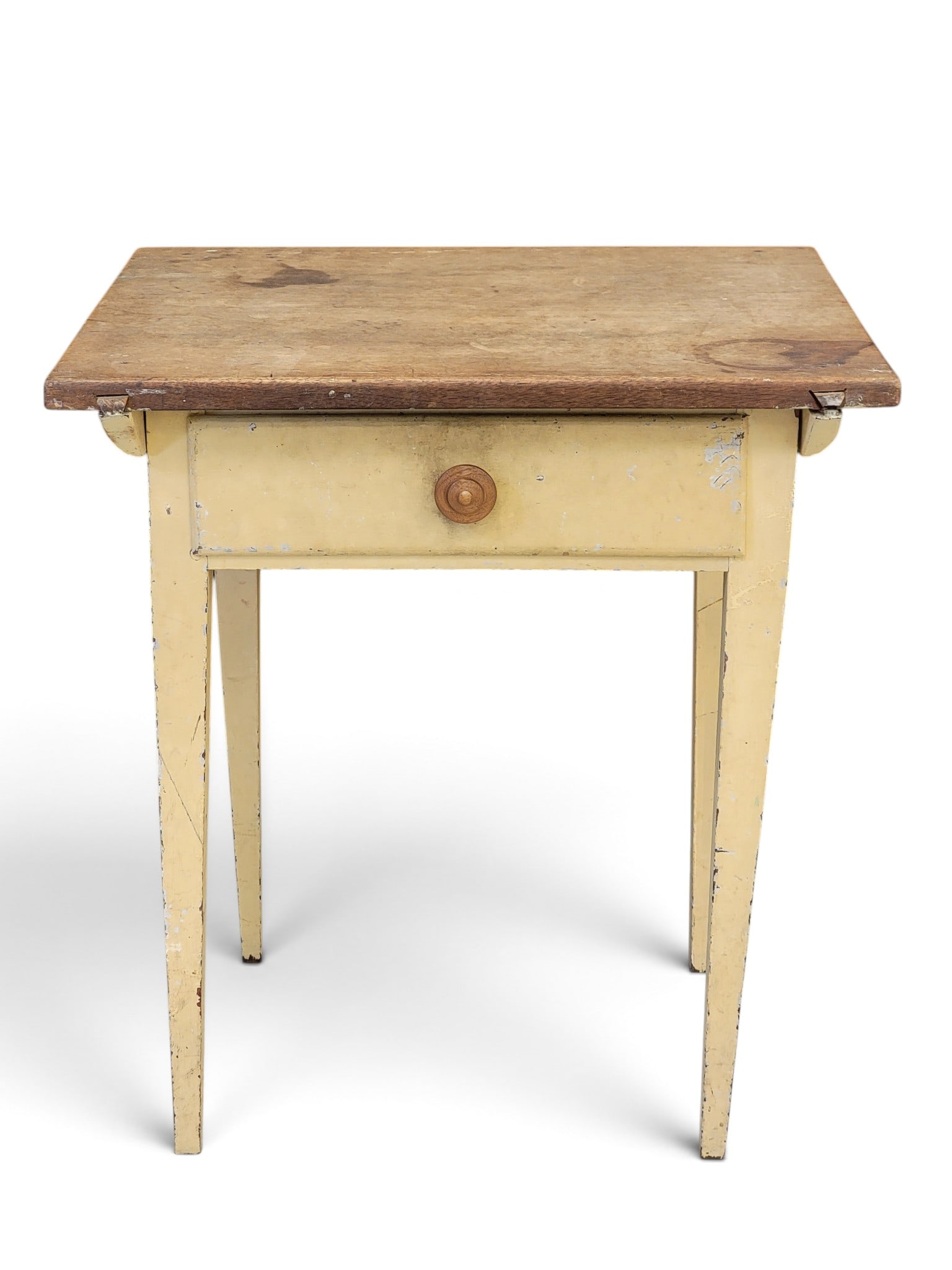 DIMINUTIVE OHIO PIN-TOP WORK TABLE: Mid-19th century, walnut and poplar. Single-board scrubbed top, the tapered-leg base with one drawer and old yellow/cream paint. 29" high, 26" wide, 21.5" deep. Provenance: an Ohio collection. NOTE: