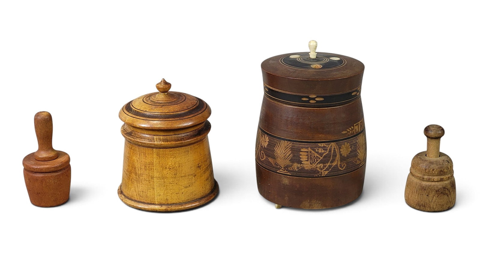 FOUR PIECES OF TREEN, INCLUDING PEASEWARE: 19th century. Includes a lidded jar by the Pease/Brown family, Lake County, Ohio, c. 1900, 4.25" high; together with a treen jar with painted and incised decoration (including "JACKSON"), and with