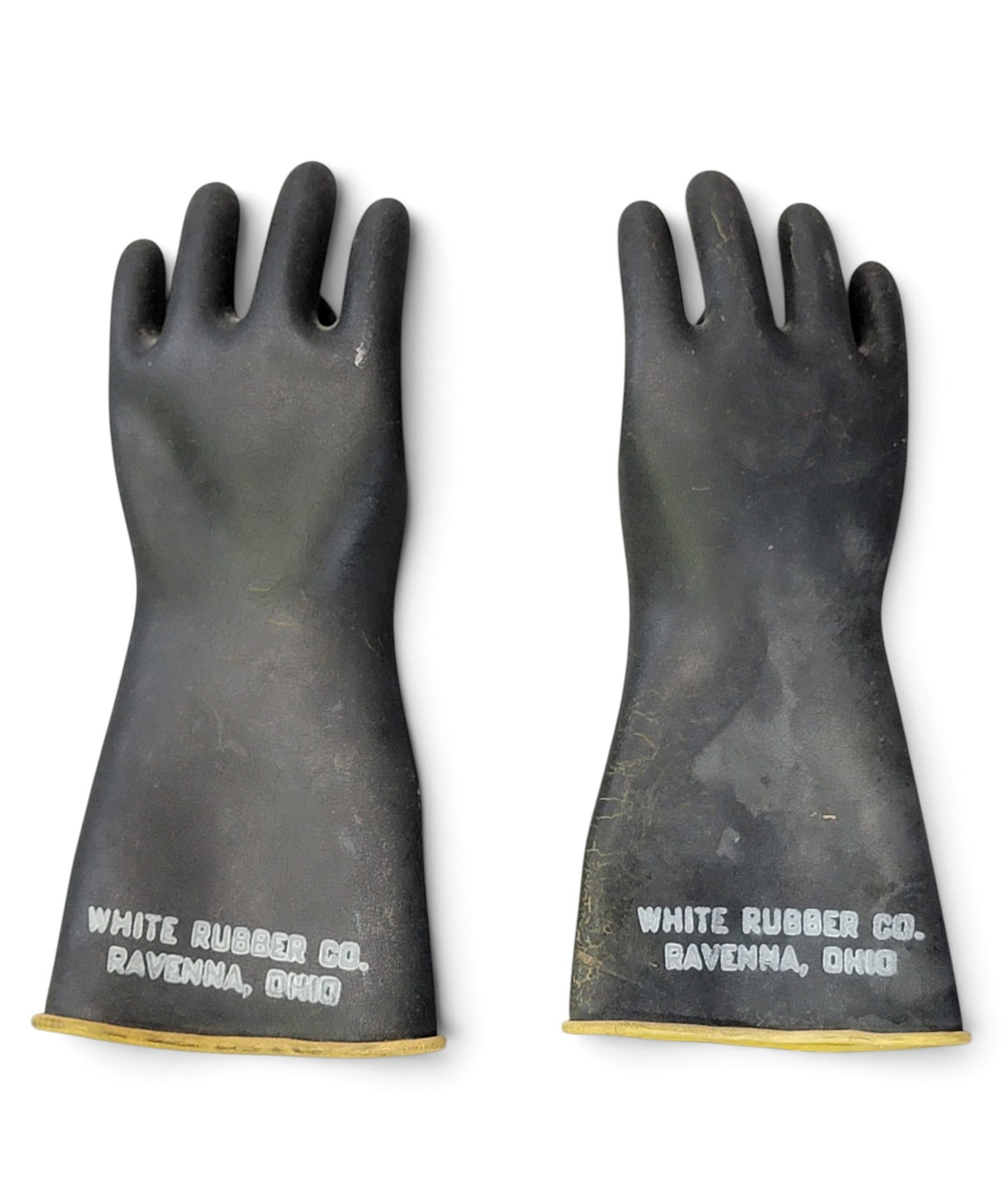 PAIR OF OHIO SALESMAN SAMPLE GLOVES: White Rubber Company, Ravenna, 20th century. Tiny, insulated rubber gloves, marked. 5" long. The first decades of the 20th century brought a manufacturing boom to Ravenna which included more than