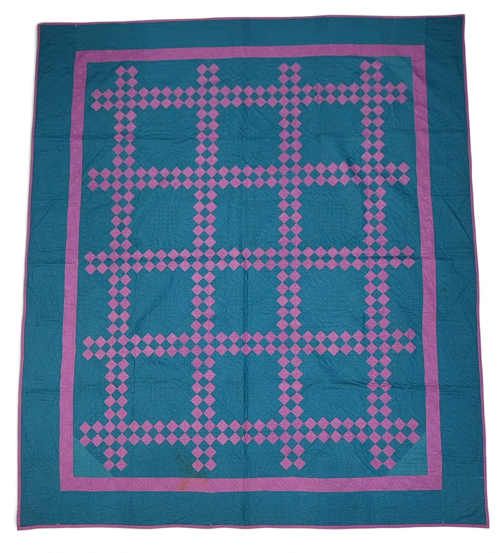 OHIO AMISH QUILT: Attributed to eastern Holmes County, 1st half-20th century. Irish chain in blue and purple, wonderfully quilted, and with a purple back. 85" by 75". Provenance: from a southeast Ohio collection.