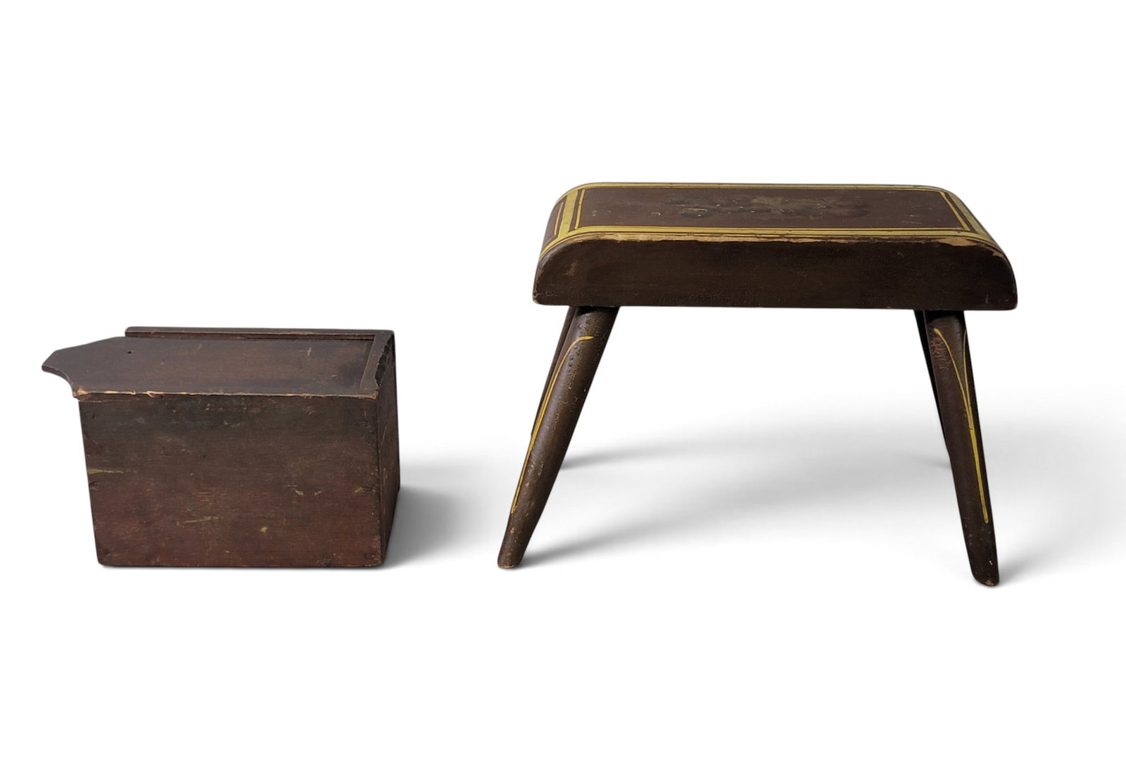 DECORATED STOOL AND DIMINUTIVE SLIDE-LID BOX: American, 2nd quarter-19th century. Includes a paint-decorated windsor stool with original fruit stenciling and yellow/gold striping on a brown ground, 13" long; together with small, square-nailed, po