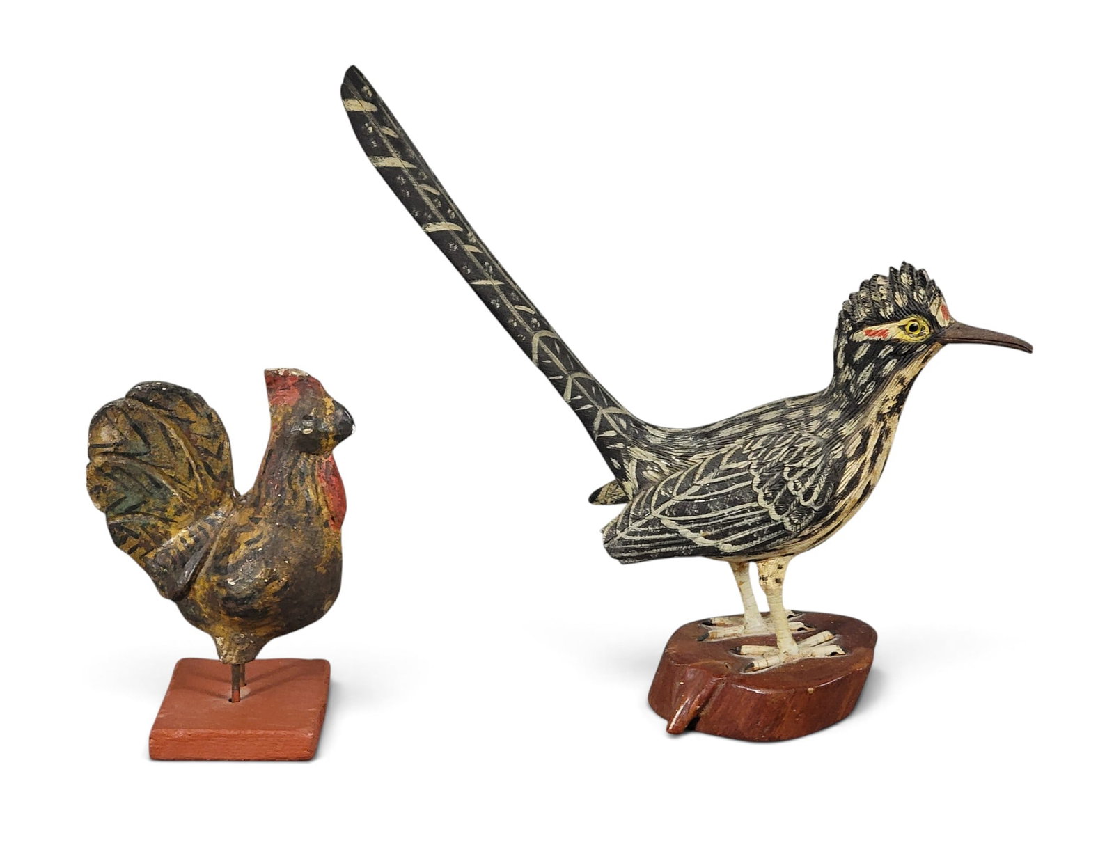 TWO CARVED AND PAINTED BIRDS: 1st half-20th century. Includes a nicely detailed greater roadrunner, 9" high; together with a rooster, 5" high. Provenance: an Ohio collection. NOTE: We are happy to answer questions and take
