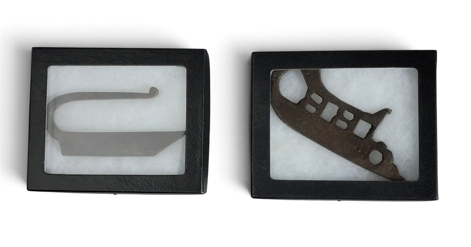 TWO WROUGHT IRON STRIKERS: 19th century. A simple example, 4.25" long; together with a fancy example, 5.5" long. Provenance: an Ohio collection. NOTE: We are happy to answer questions and take additional photos of lots prior