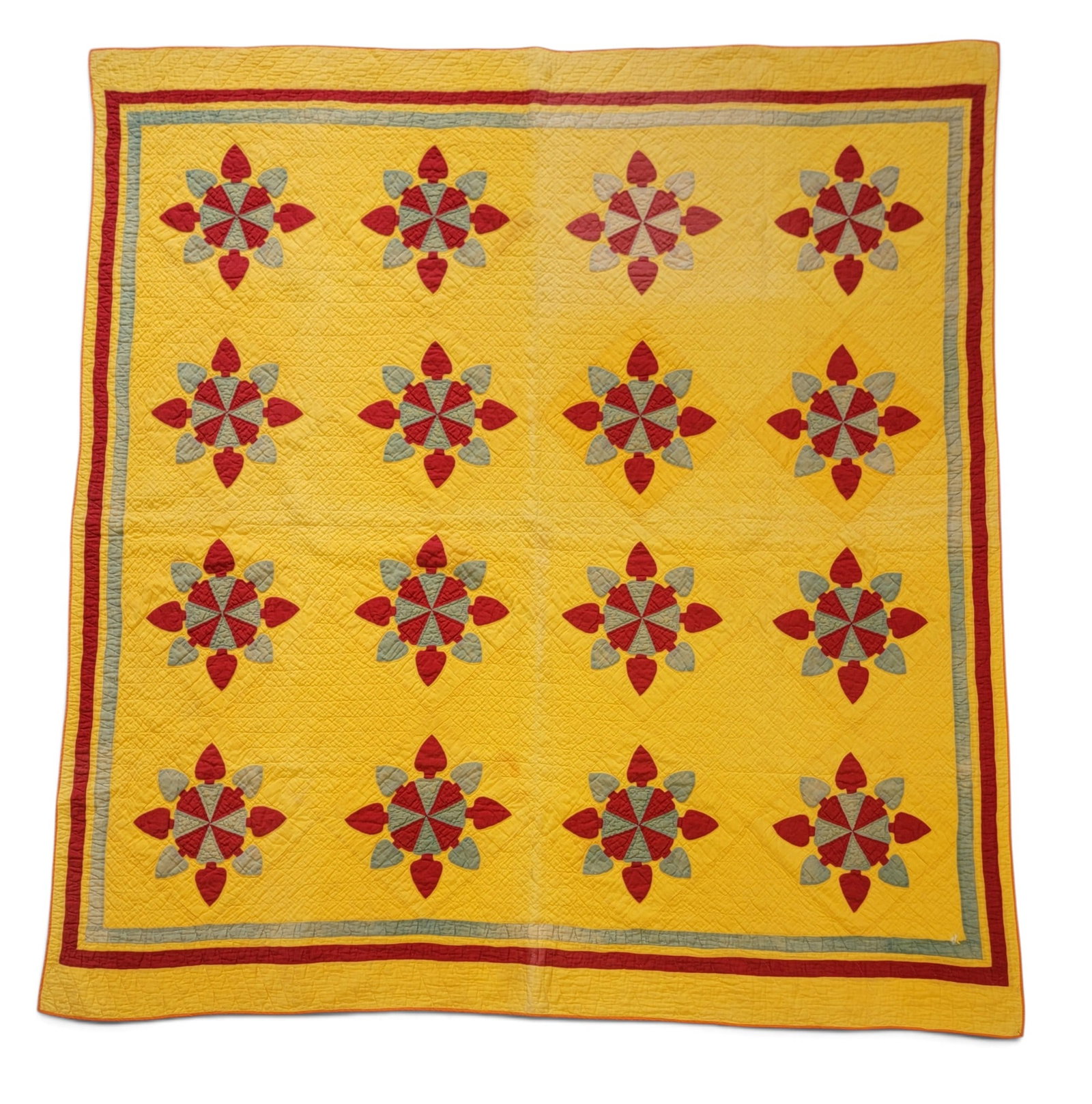 APPLIQUE QUILT: American, late 19th century. Unusual red and green motifs on a light cheddar ground. 73.75" by 69". Provenance: a Pennsylvania collection. NOTE: We are happy to answer questions and take additional