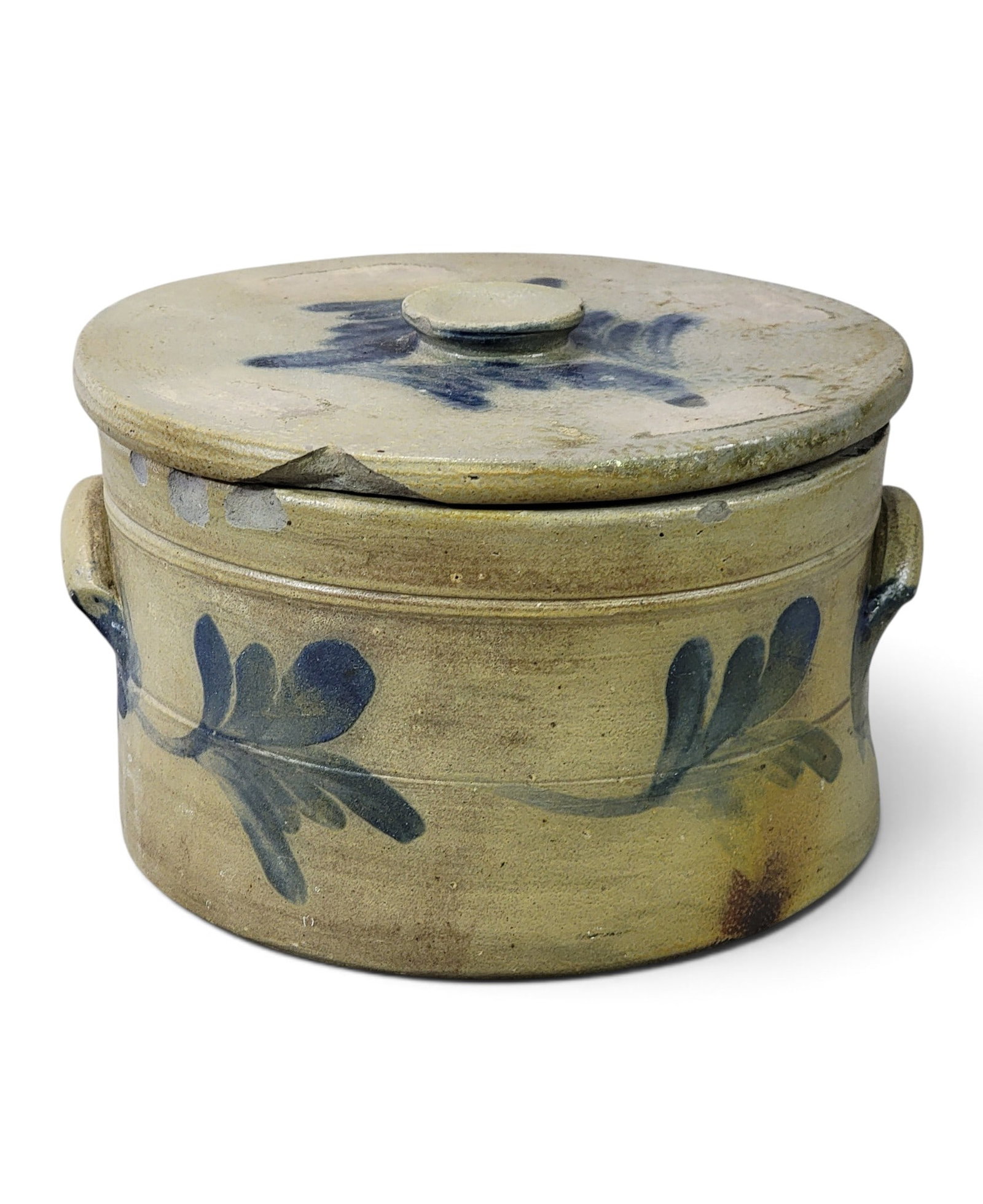 COBALT-DECORATED STONEWARE CAKE CROCK: Probably Richard Remmey, Philadelphia, Pennsylvania, c. 1870. With brushed foliate design. 6" high, 8.5" diameter. Provenance: a southeast Pennsylvania collection. NOTE: We are happy to answer