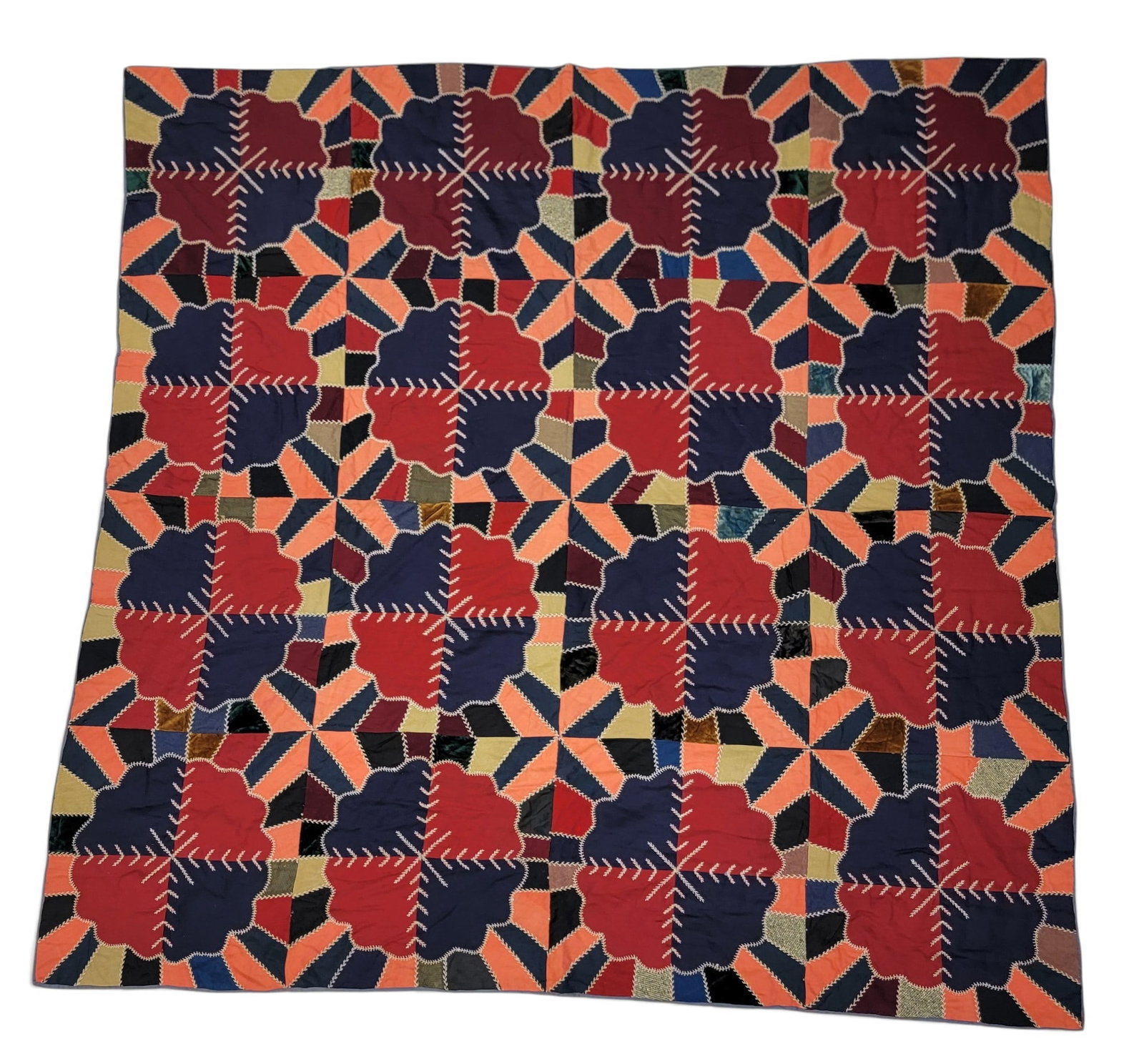 CRAZY QUILT: American, late 19th-early 20th century. Sixteen squares with "wavy" circles, and with extensive decorative stitching, the tied back in dark blue. 75" by 74". Provenance: an Ohio collection. NOTE: We
