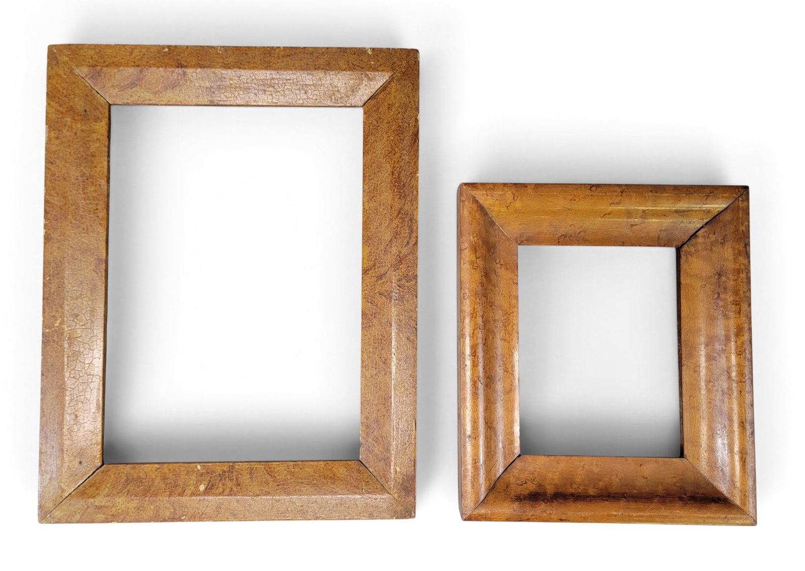 TWO PERIOD FRAMES: American, 19th century. includes a birdseye maple frame, 10.25" by 12"; together with an original paint-decorated frame, 17" by 13.5". Provenance: an Ohio collection. NOTE: We are happy to answer