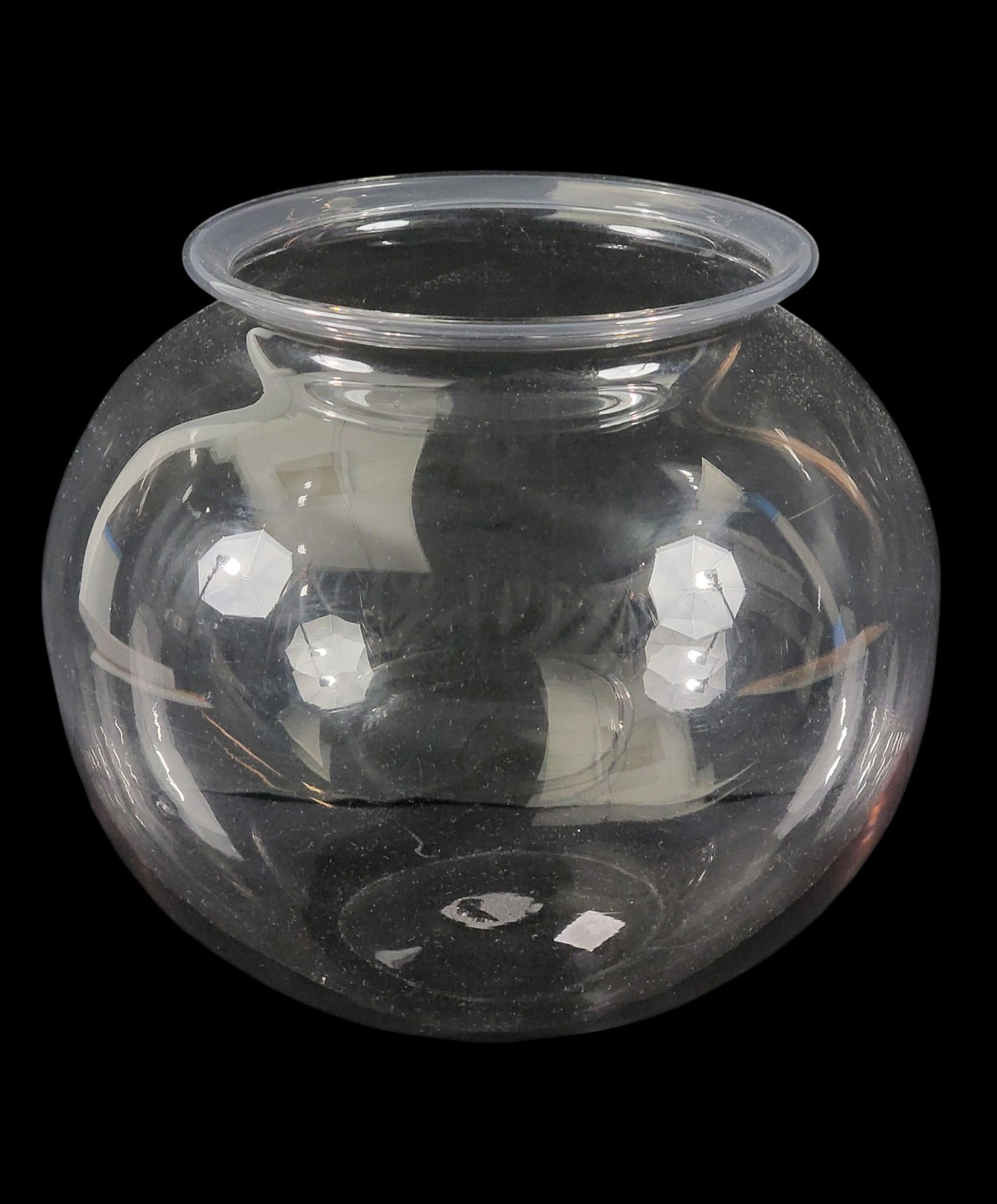 BLOWN GLASS FISHBOWL: American, mid-19th century, colorless glass. Nearly spherical bowl with flared and folded rim, and pontil mark. 10" high, 11" diameter. Provenance: the collection of Marci and Dean Zimmerman,