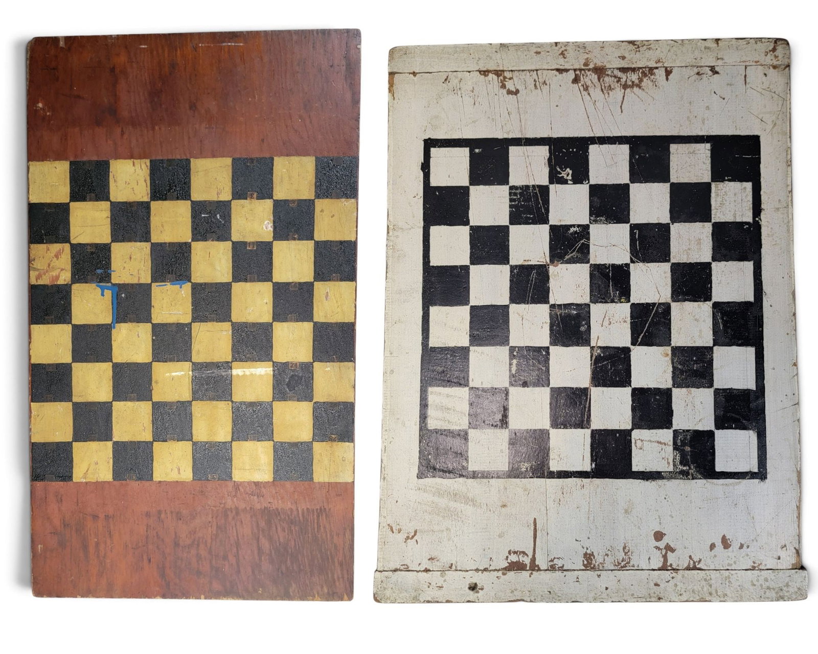 TWO DECORATED GAMEBOARDS: American, 1st half-20th century. Includes a breadboard double-sided board with black and white paint, 27.25" by 20.25"; together with a pine checkerboard with grungy black and white paint, 28" by