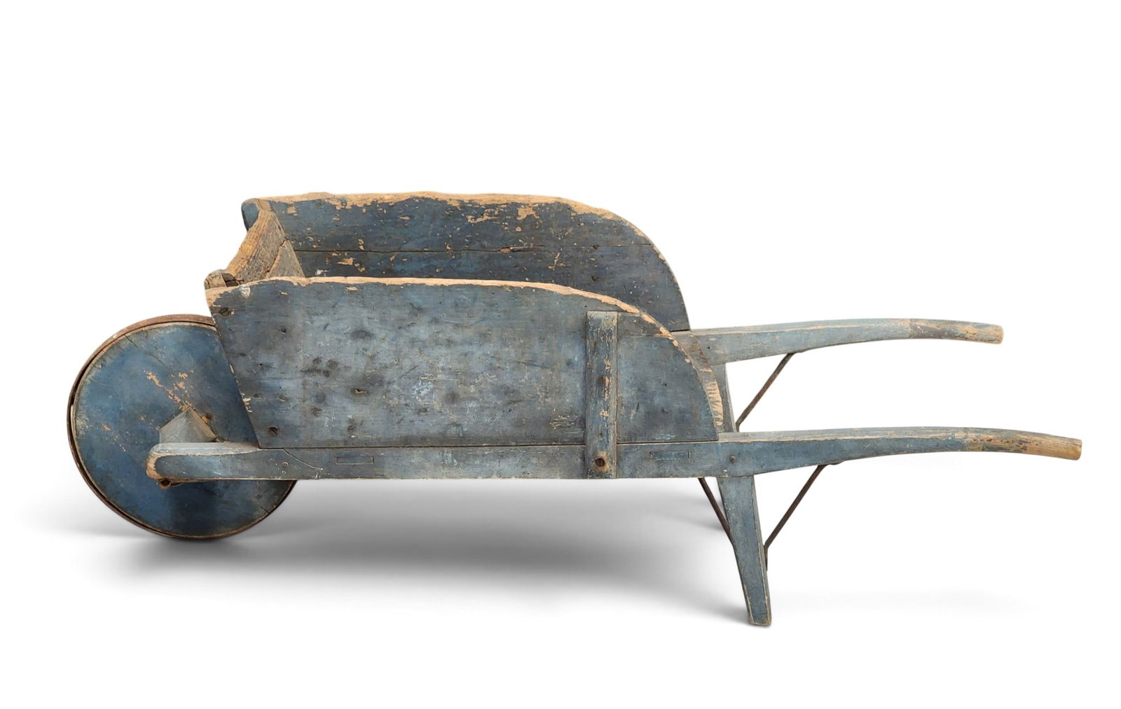 EARLY PAINTED WHEELBARROW: American, 19th century, pine. Small size, with iron-rimmed wheel, and with its original blue paint. 16.75" high, 20" wide, 50" long. Provenance: a New York State collection NOTE: We are happy to answe