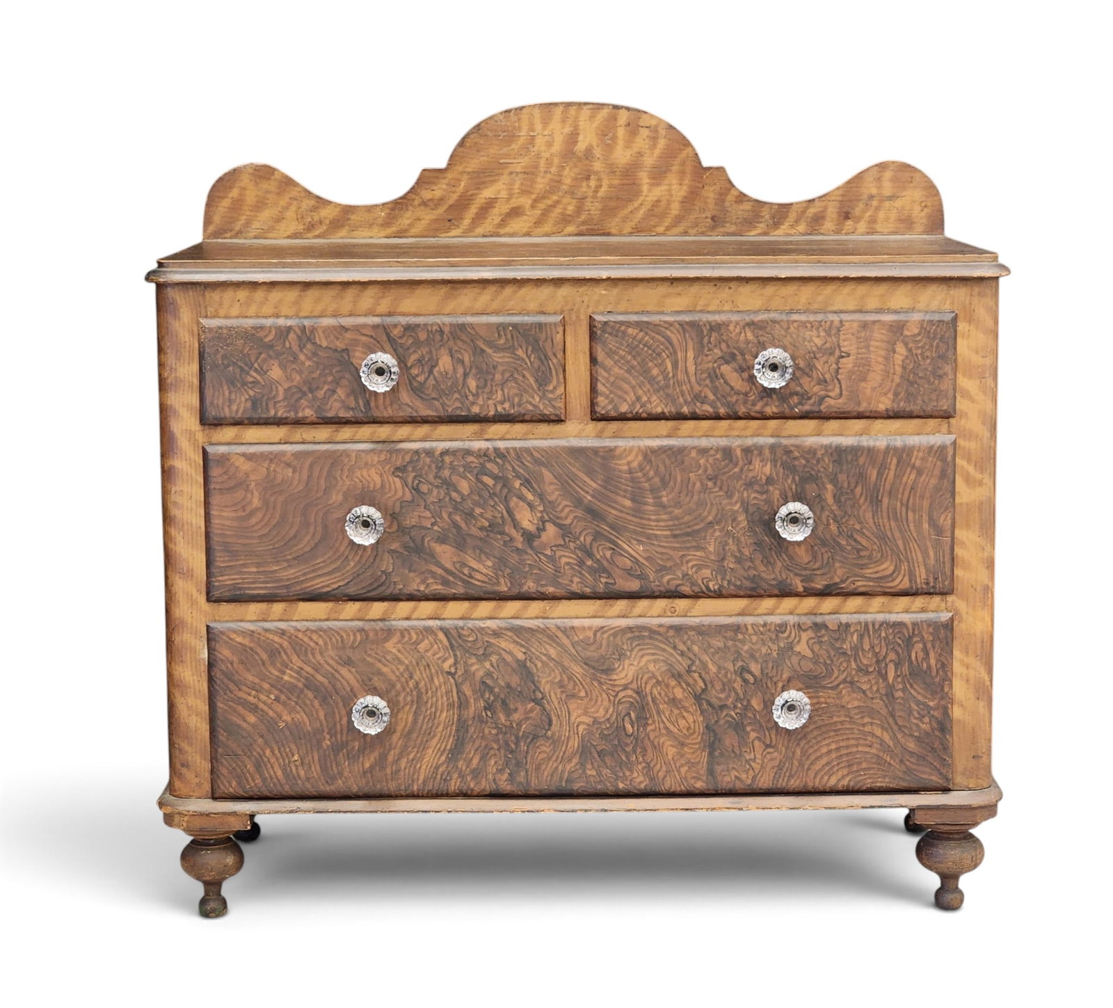 PAINT-DECORATED DRESSING CHEST OF DRAWERS: 19th century, pine. Two short over two long drawers, with a backsplash, and on turned feet. Retains its original grain-painted decoration. 40.5" high, 42" wide, 20.5" deep. Provenance: a New York