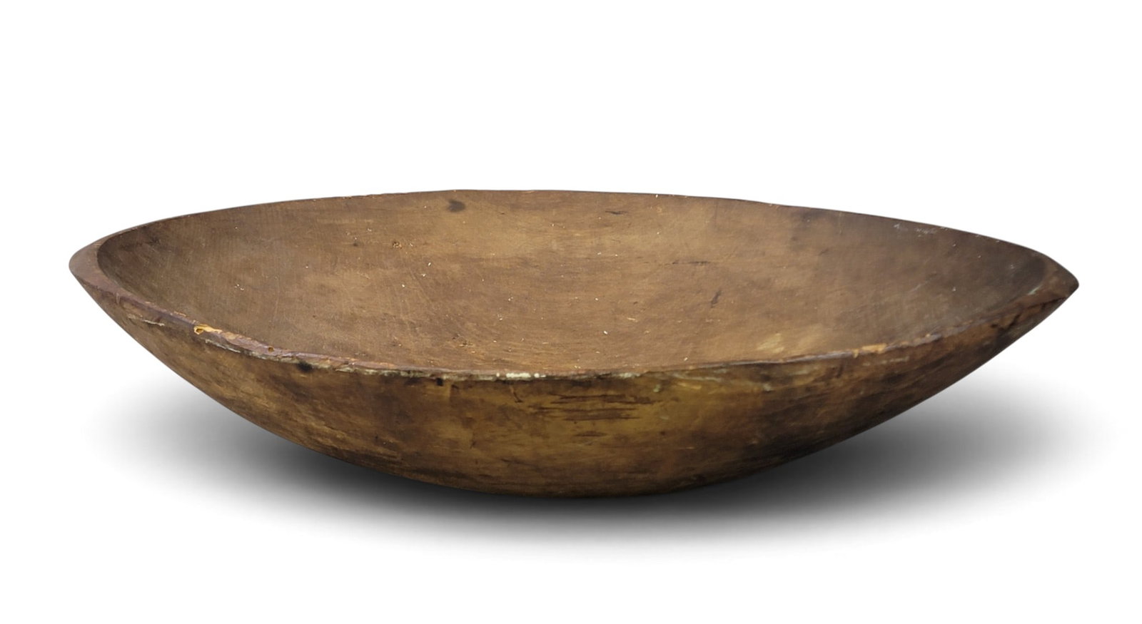 LARGE TREEN DOUGH BOWL: American, dated 1787 on the underside, maple. Of grand size, oblong, and with an early or original surface. 19.5" by 30". Provenance: a New York State collection NOTE: We are happy to answer