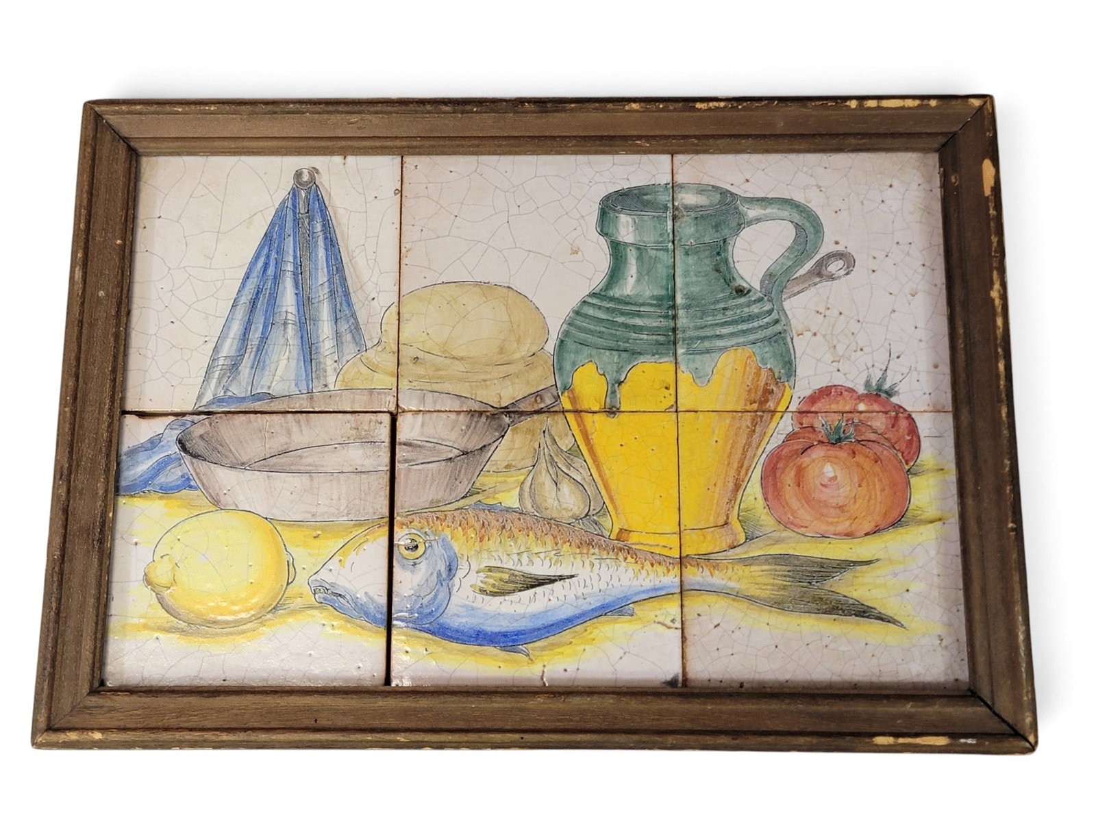 TILE STILL LIFE WITH FISH: Spanish or Italian, tin-glazed earthenware. Still life comprised of 6 tiles, including a fish and a green-glazed redware oil or wine jug, framed. 13" high, 18.5" wide. Provenance: a New York State